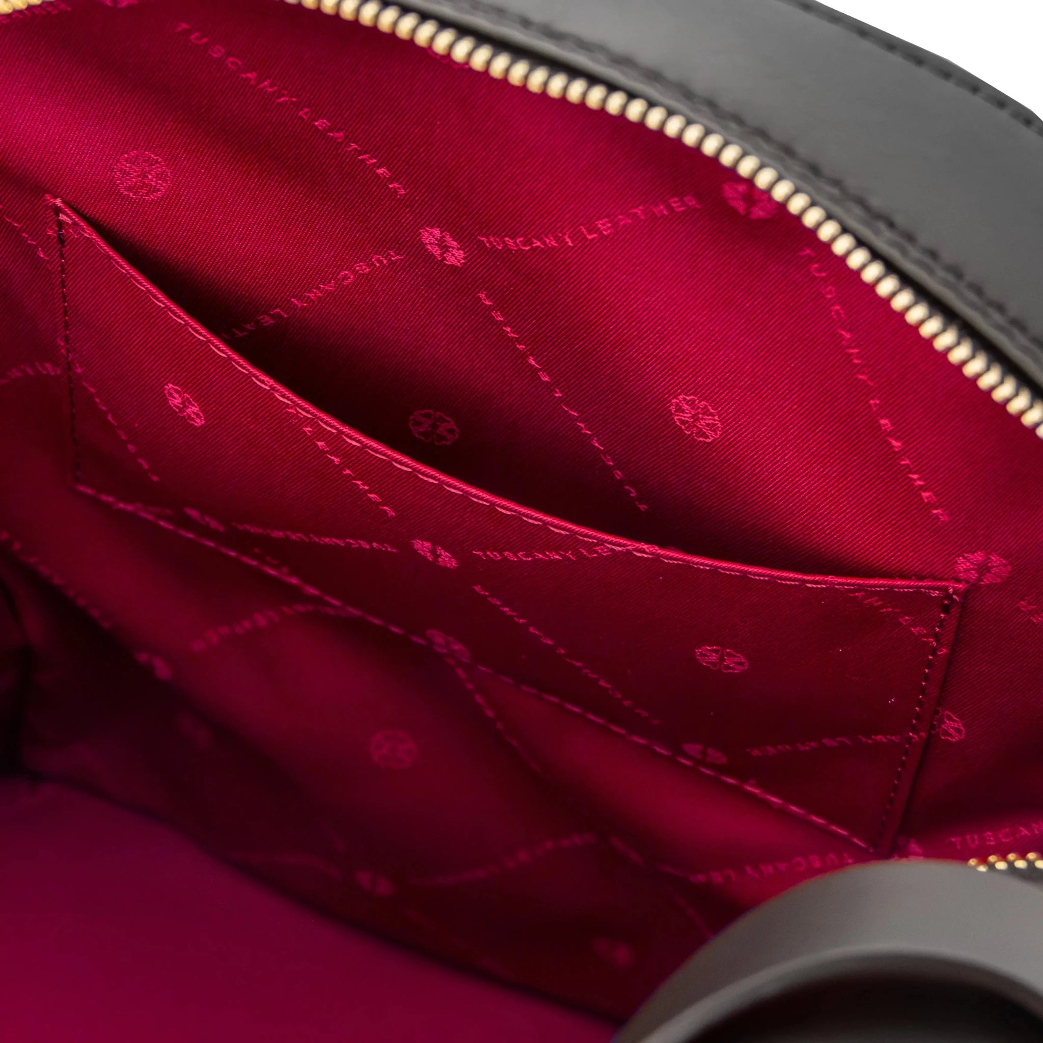 Interior open pocket view Dedalo Woven Leather Backpack in black with red lining