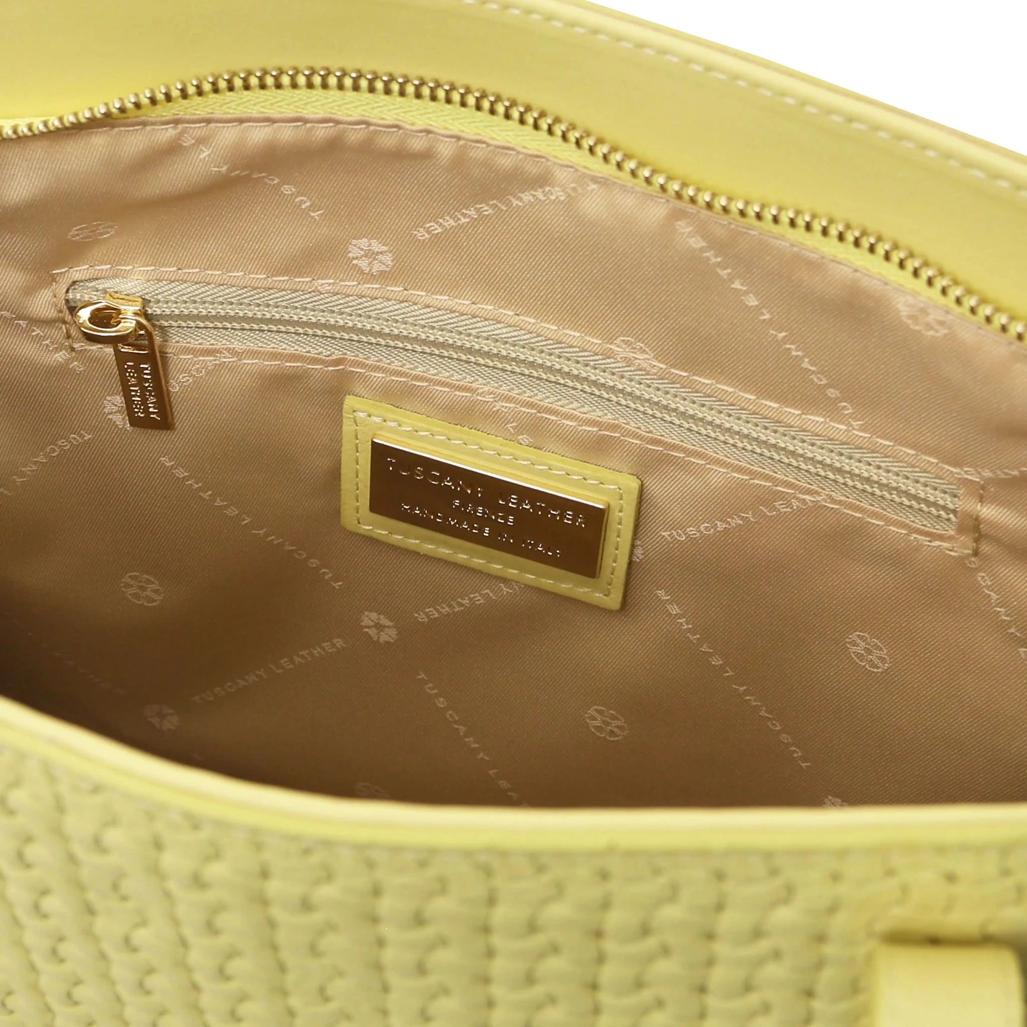 Interior zip pocket view Dedalo Woven Leather Shopping Bag in pastel yellow with beige lining