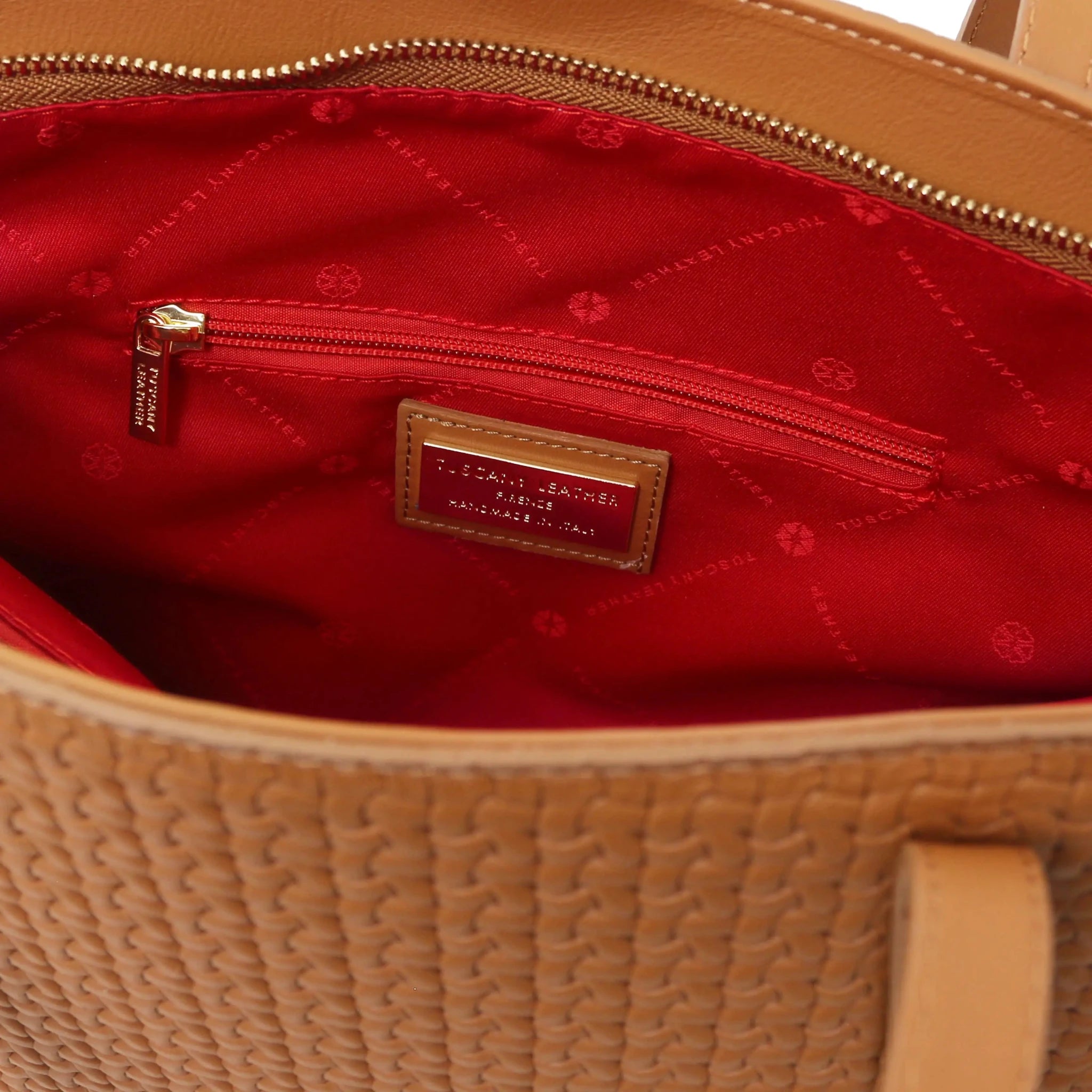 Interior zip pocket view Dedalo Woven Leather Shopping Bag in cognac with red lining