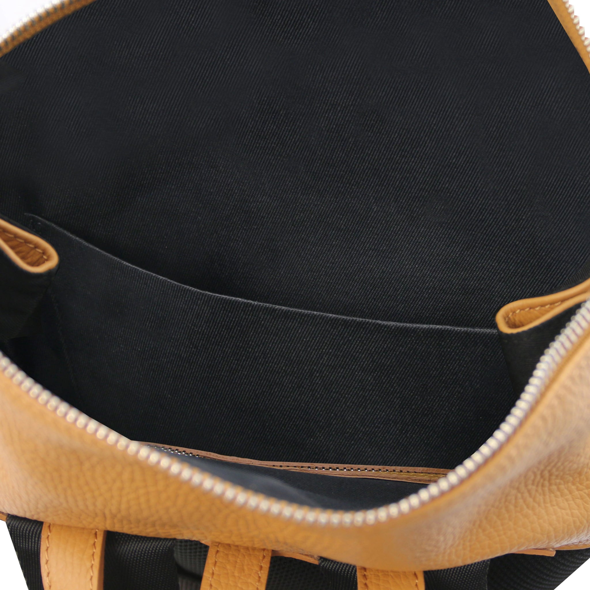 Interior view Denver Soft Italian Leather Backpack in Caramel showing black lining, And open pocket.