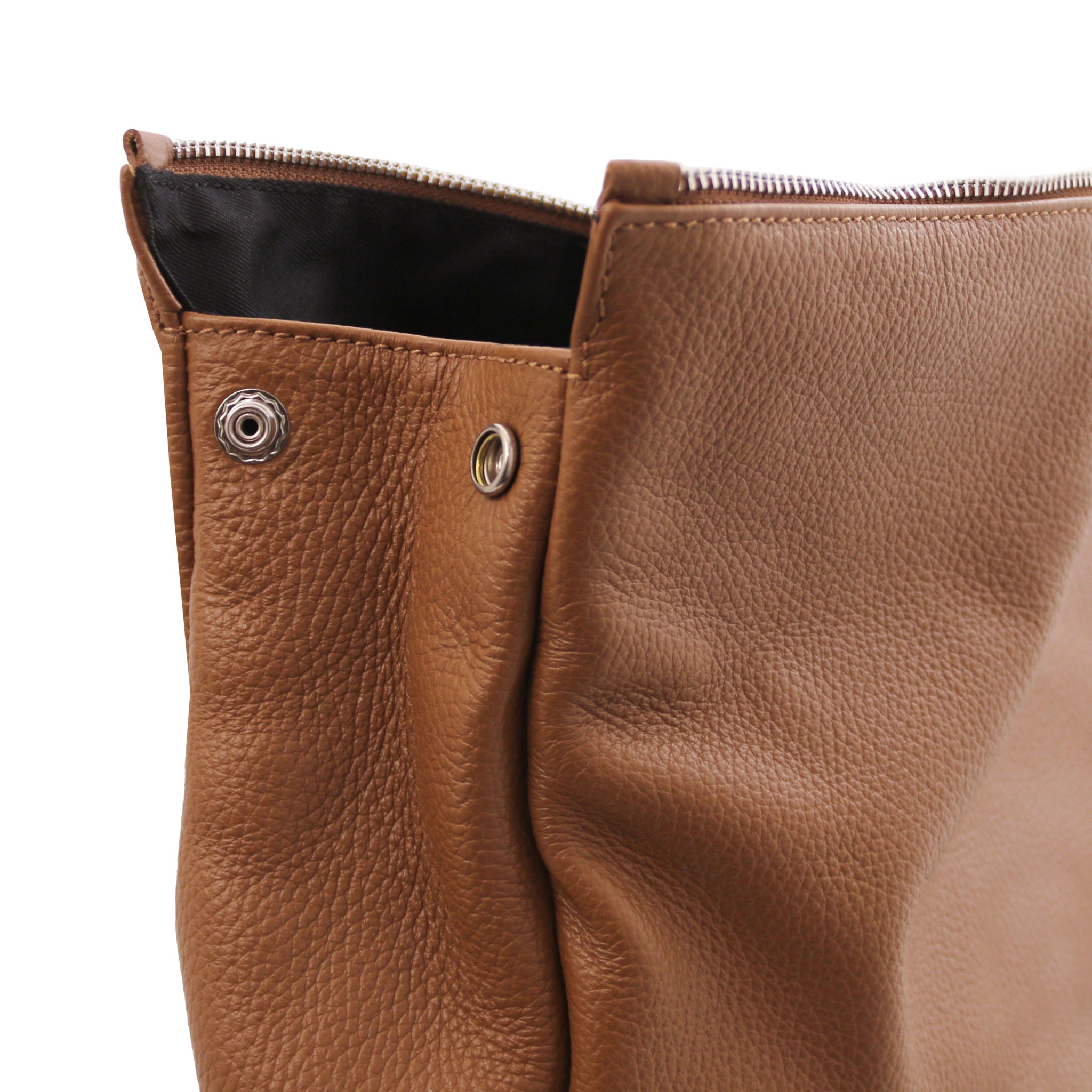 Side view Denver Soft Italian Leather Backpack in Cognac featuring main side snap closure