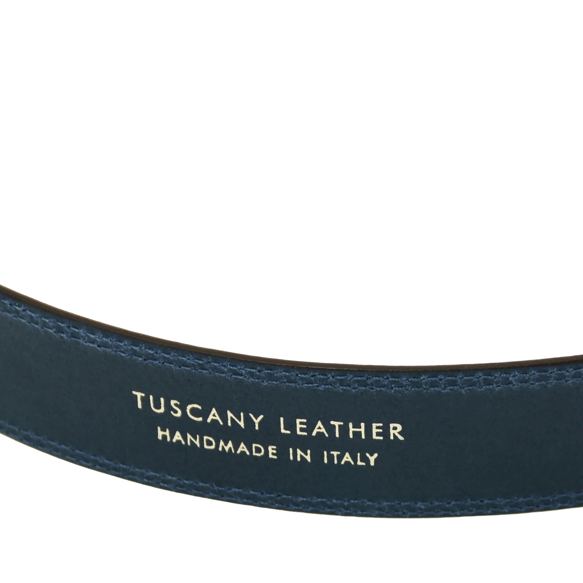 Close-up of a dark blue leather belt with 'Tuscany Leather Handmade in Italy' text on a white background