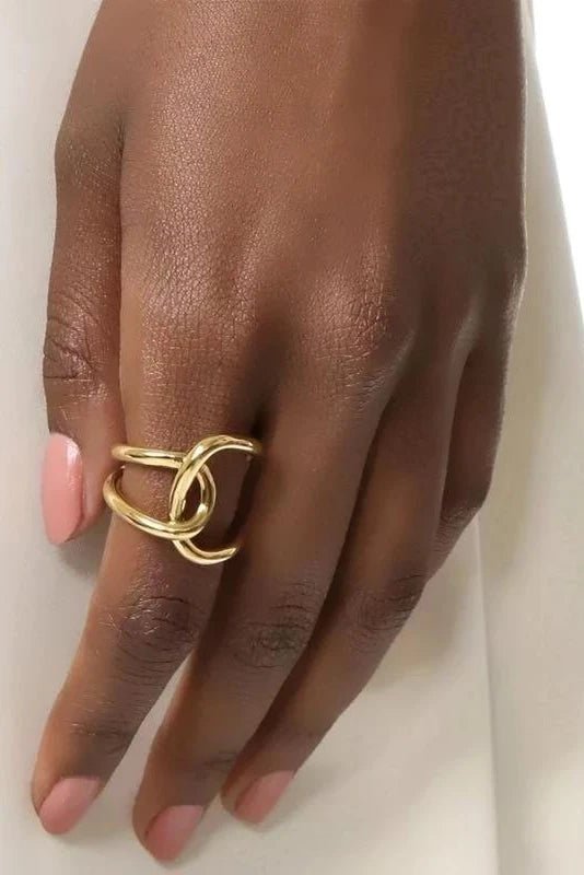 Close up view Downtown Golden Ring on a women's index finger