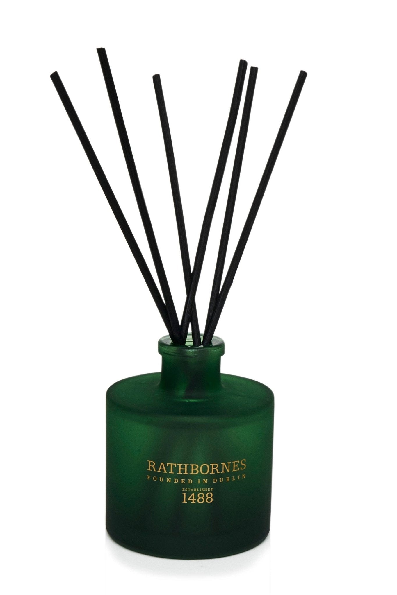 Dublin Retreat Scented Reed Diffuser (Musk, Black Ebony & Amber) green bottle on a white background