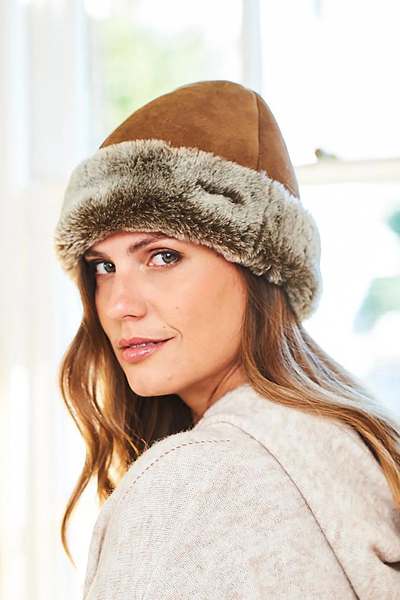 English Sheepskin Classic Beanie Hat in Tan Ottoman on a female model