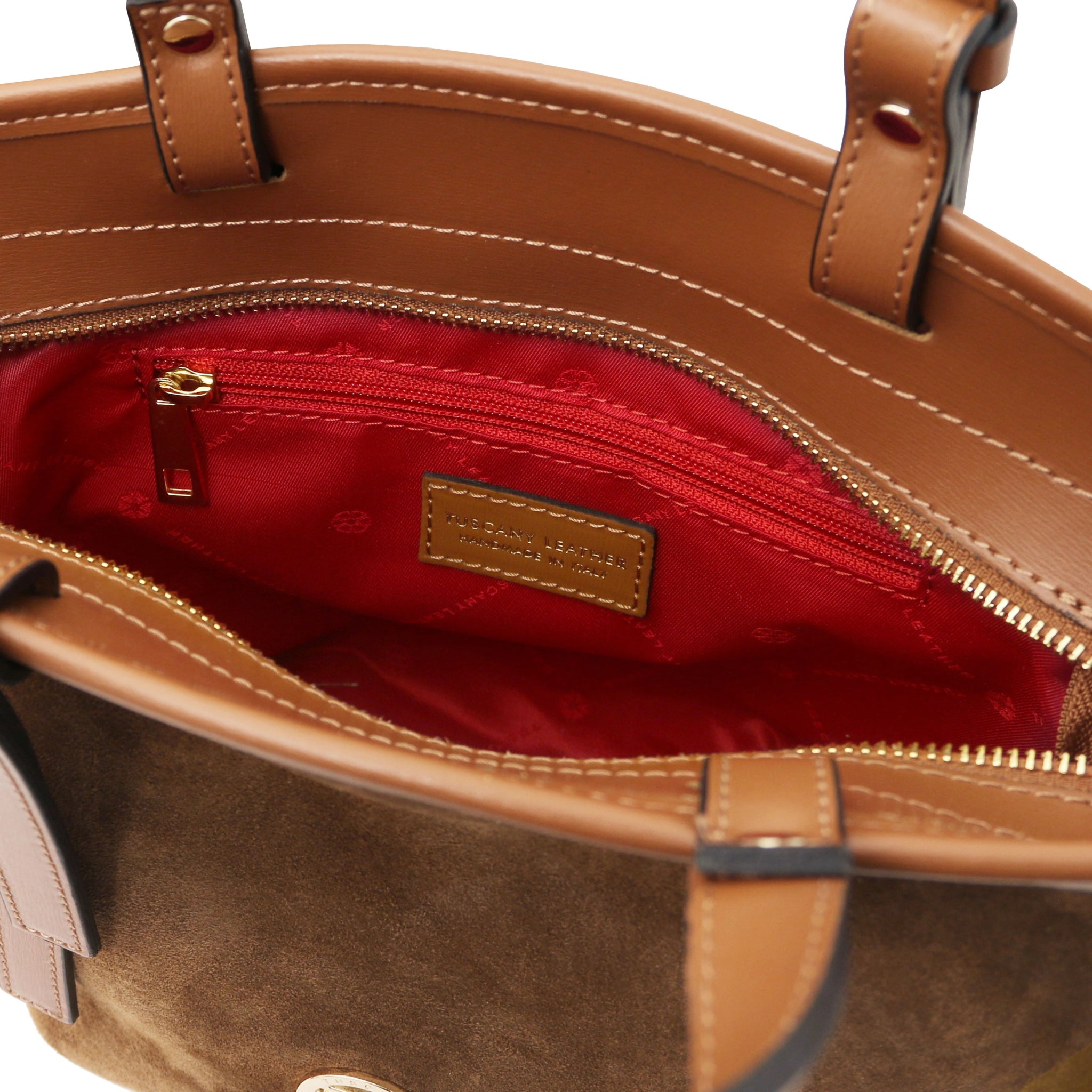 Interior zip pocket red lining view Glacette Suede Bucket bag in Cognac