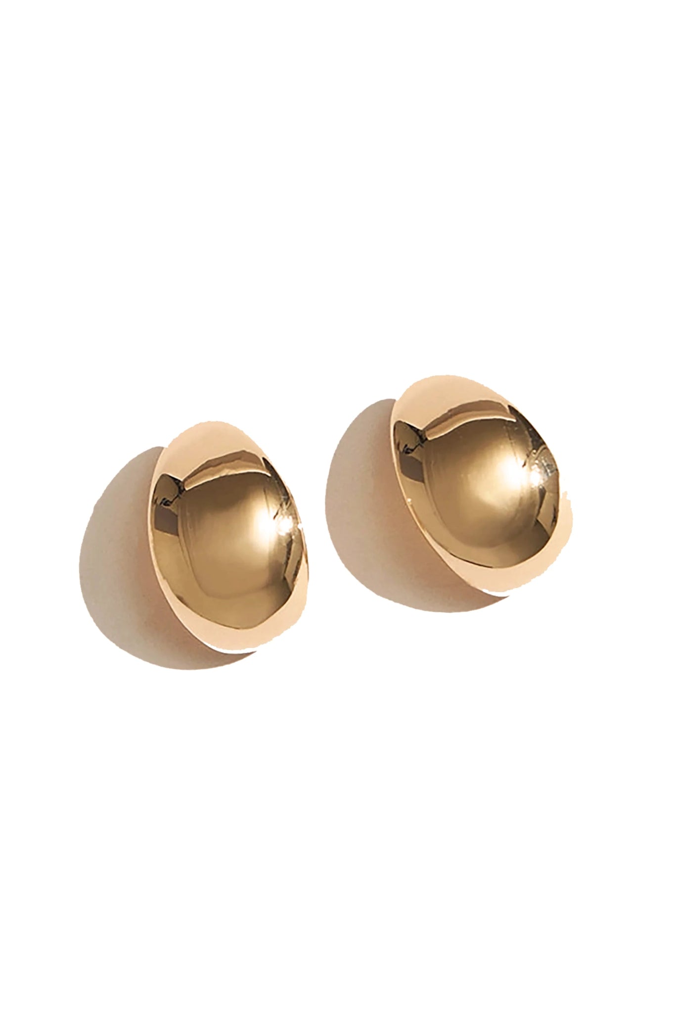 Golden Serenity Huggie Hoop Earrings -close up on a white background