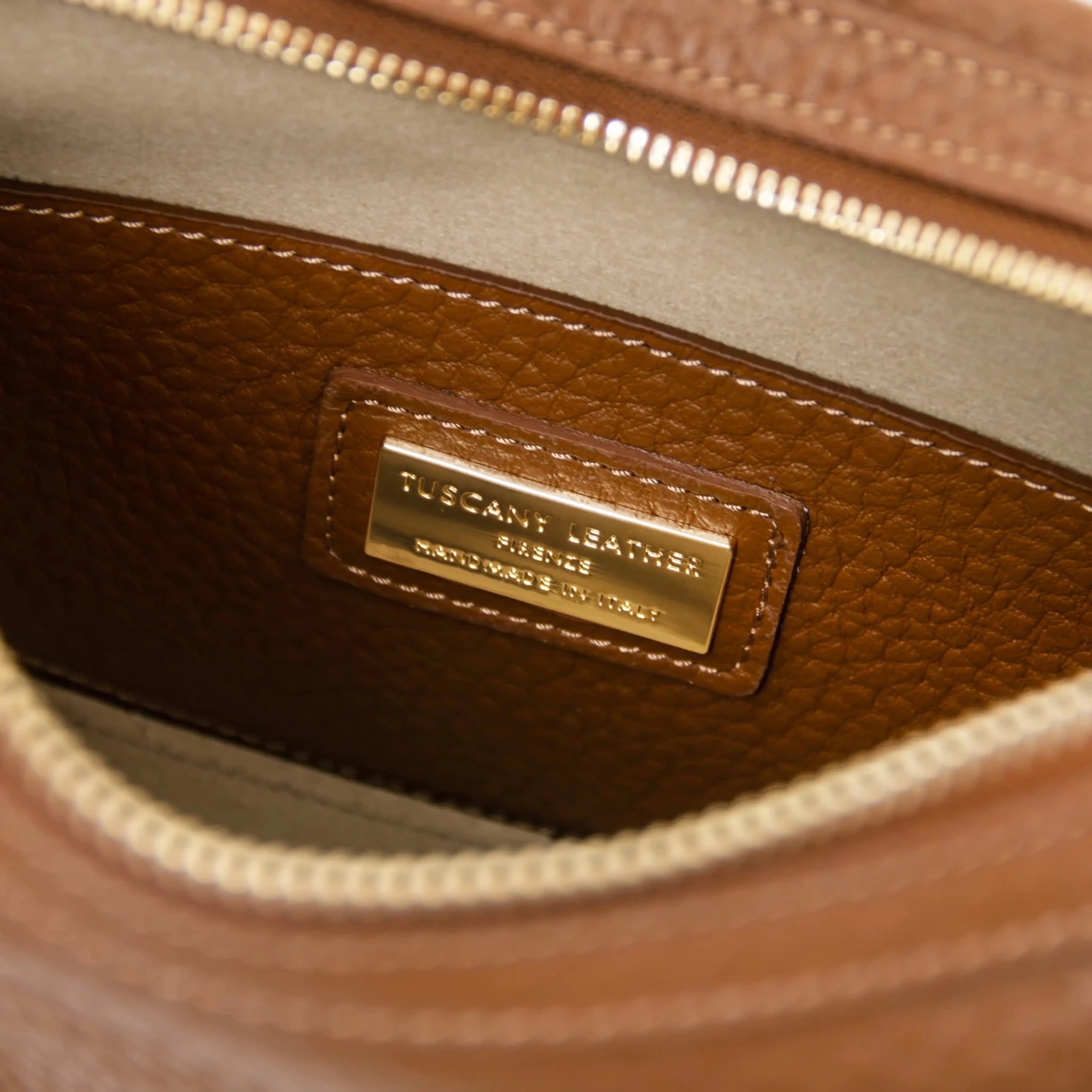 Interior zip pocket view Hoblò Soft Italian Leather Handbag in Cognac with beige lining