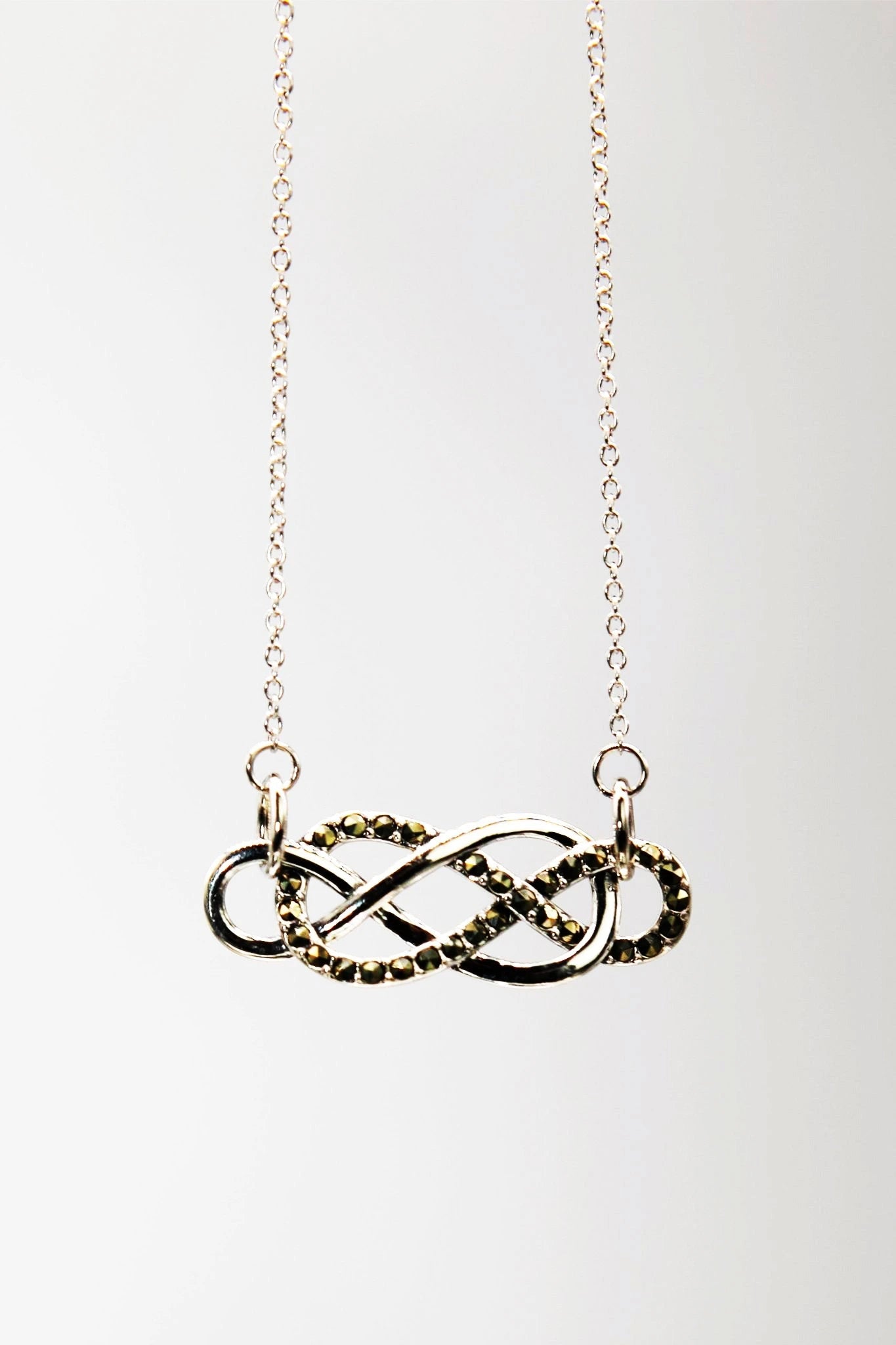 Irish Infinity Celtic Knot Necklace on a white background - L'Atelier Global