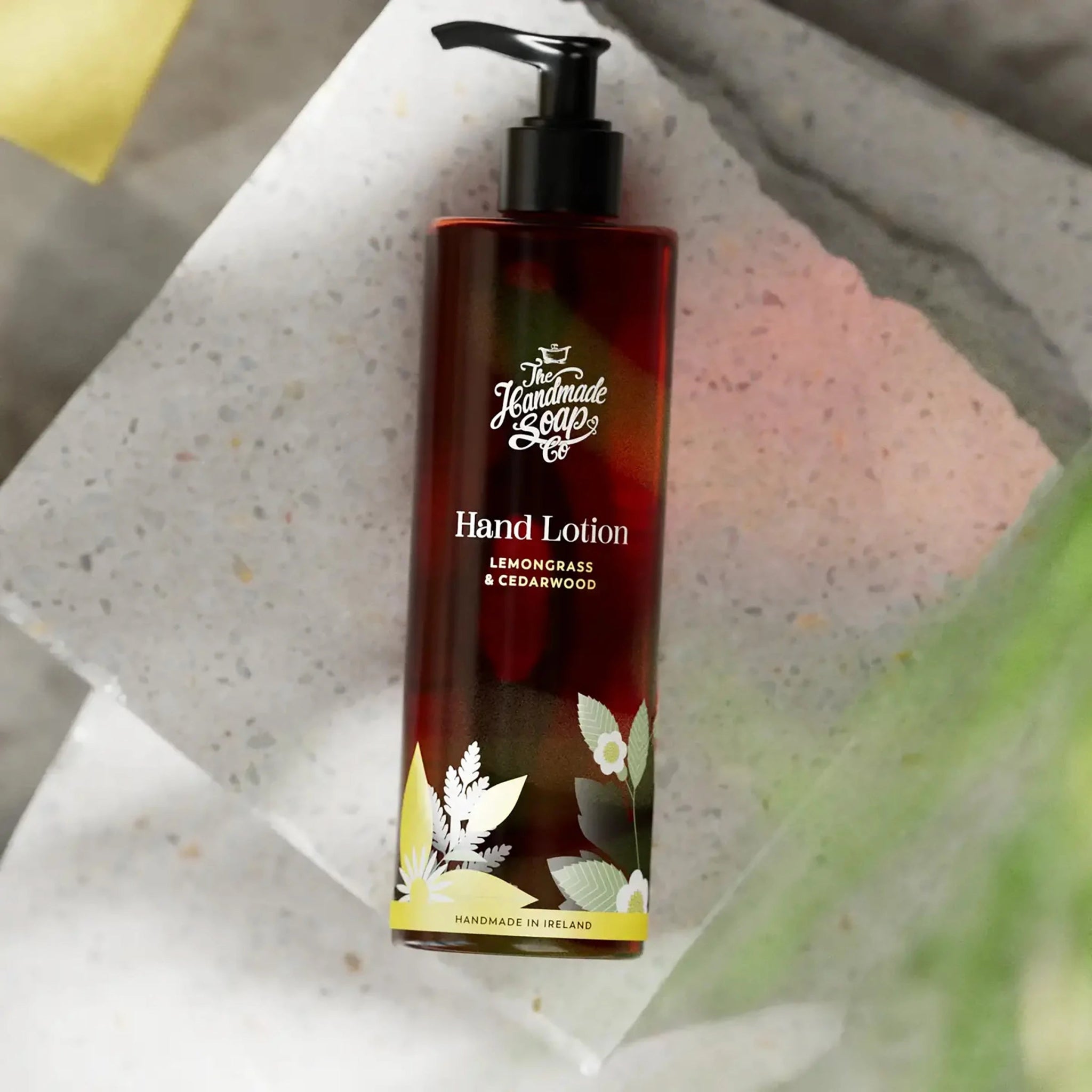 Hand lotion bottle with pump on a textured surface