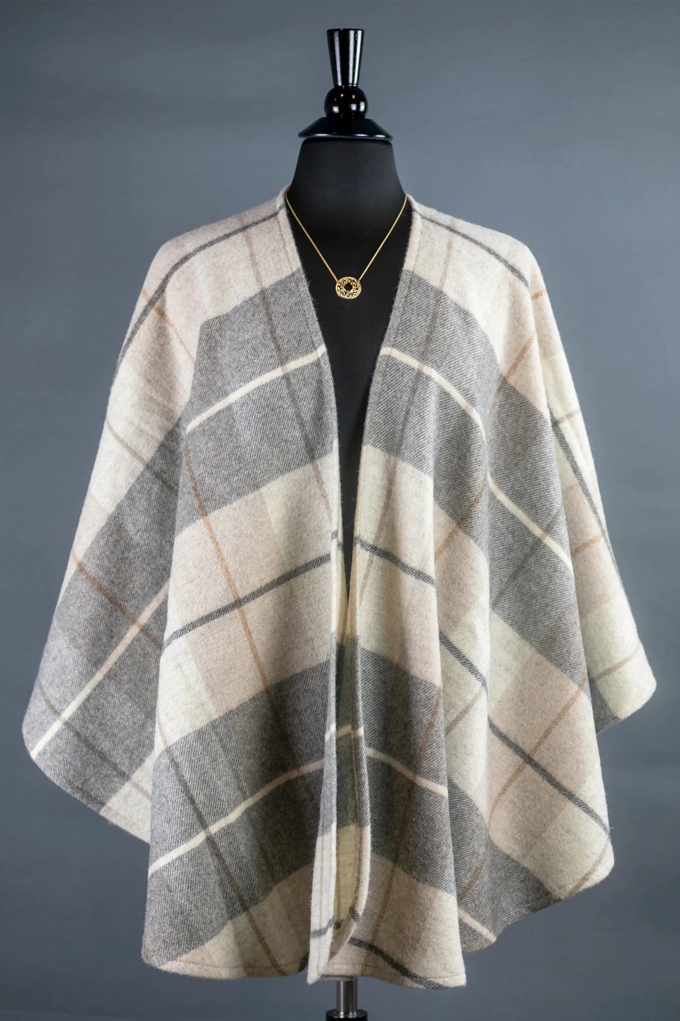 Irish Winter Cozy Tartan Ruana Wrap on a black bust form gray background