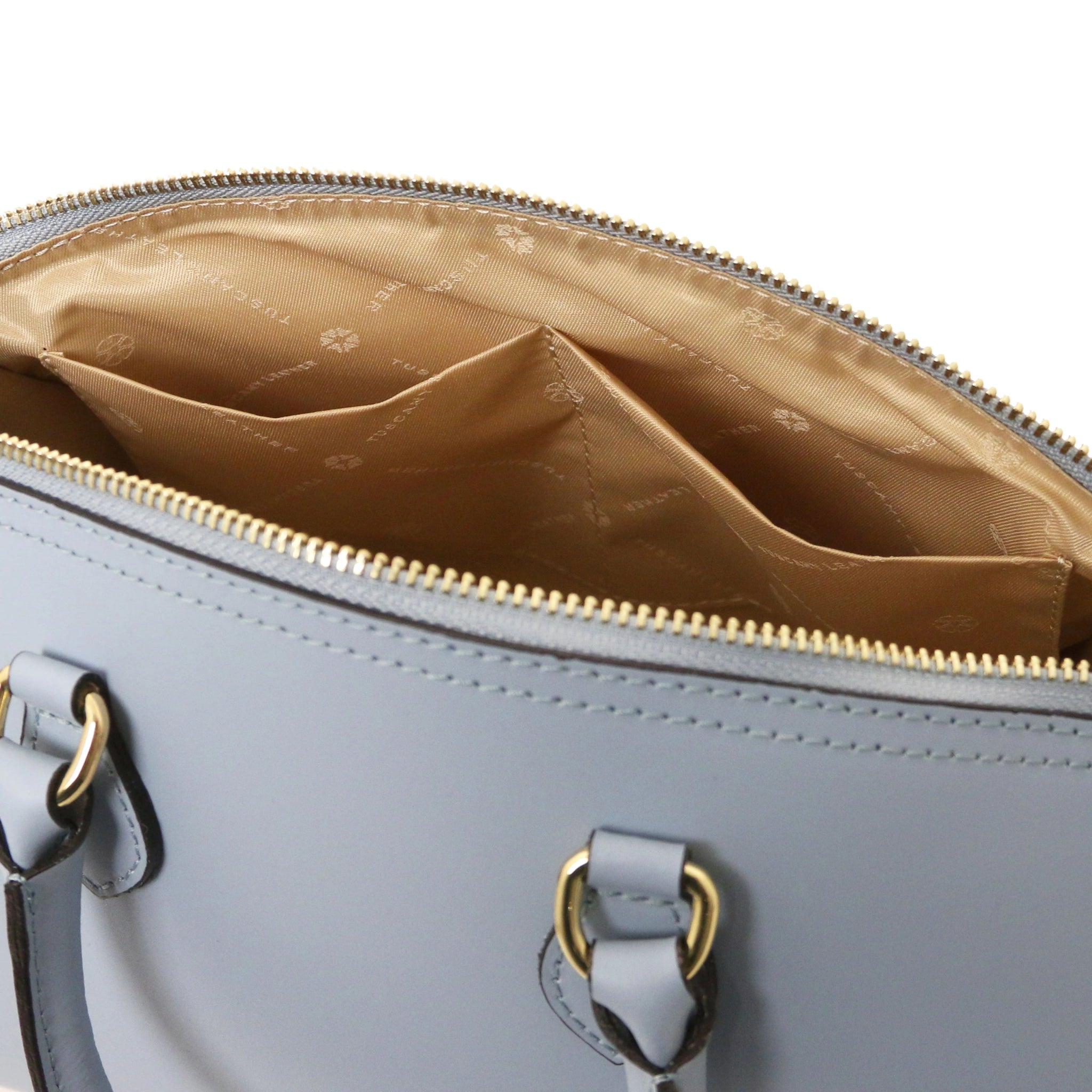 Interior open pockets view of Layla Italian Leather Duffle Bag in light blue showing beige bag lining