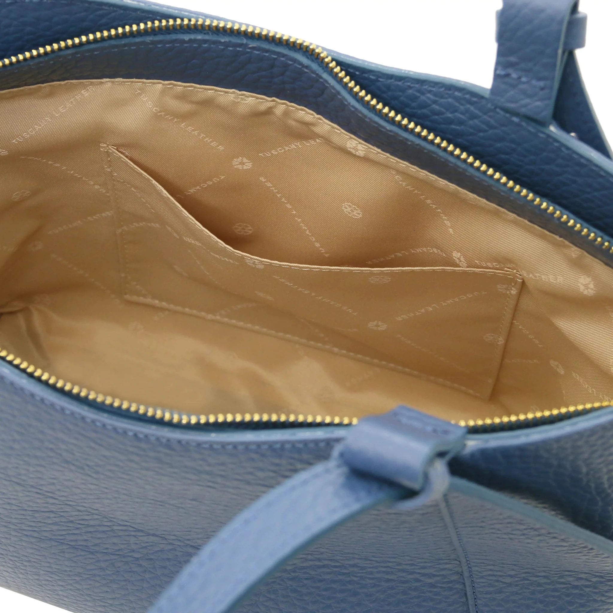 Interior open pocket view Libra Leather Shoulder Bag in denim with tan lining