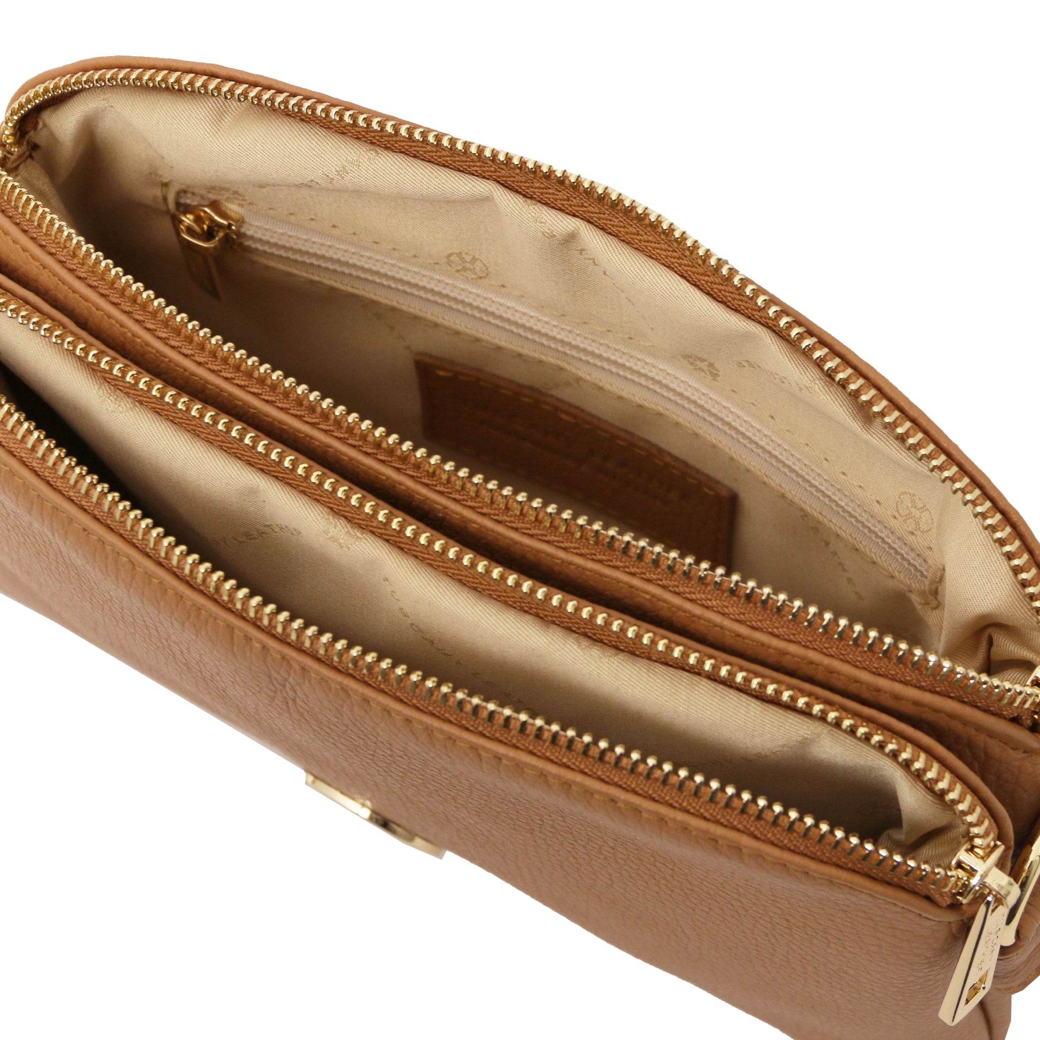 Interior zippered pocket view Lily Soft Italian Pebbled Leather Shoulder Bag in cognac showing beige bag lining