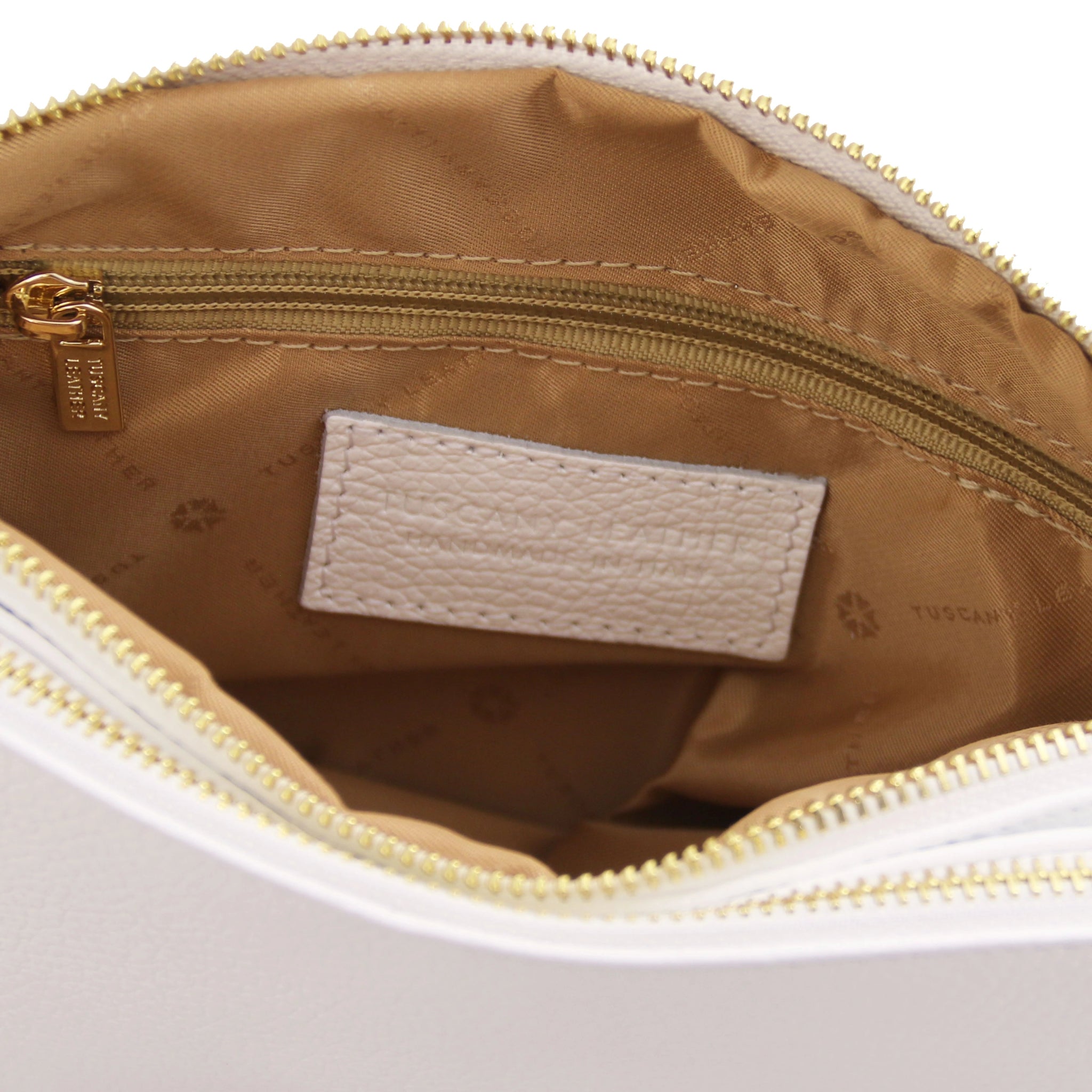 Interior zippered pocket view Lily Soft Italian Pebbled Leather Shoulder Bag in white showing beige bag lining