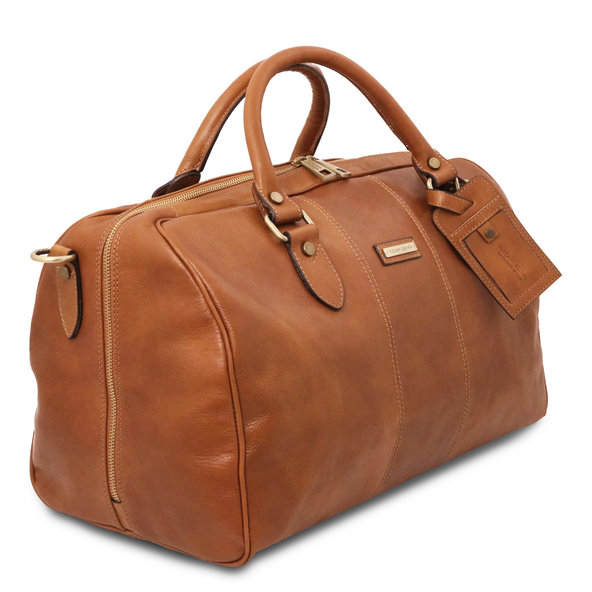Side View Lisbona Travel Italian Matte Leather Small Duffle Bag in Natural showing handle, shoulder strap and luggage tag