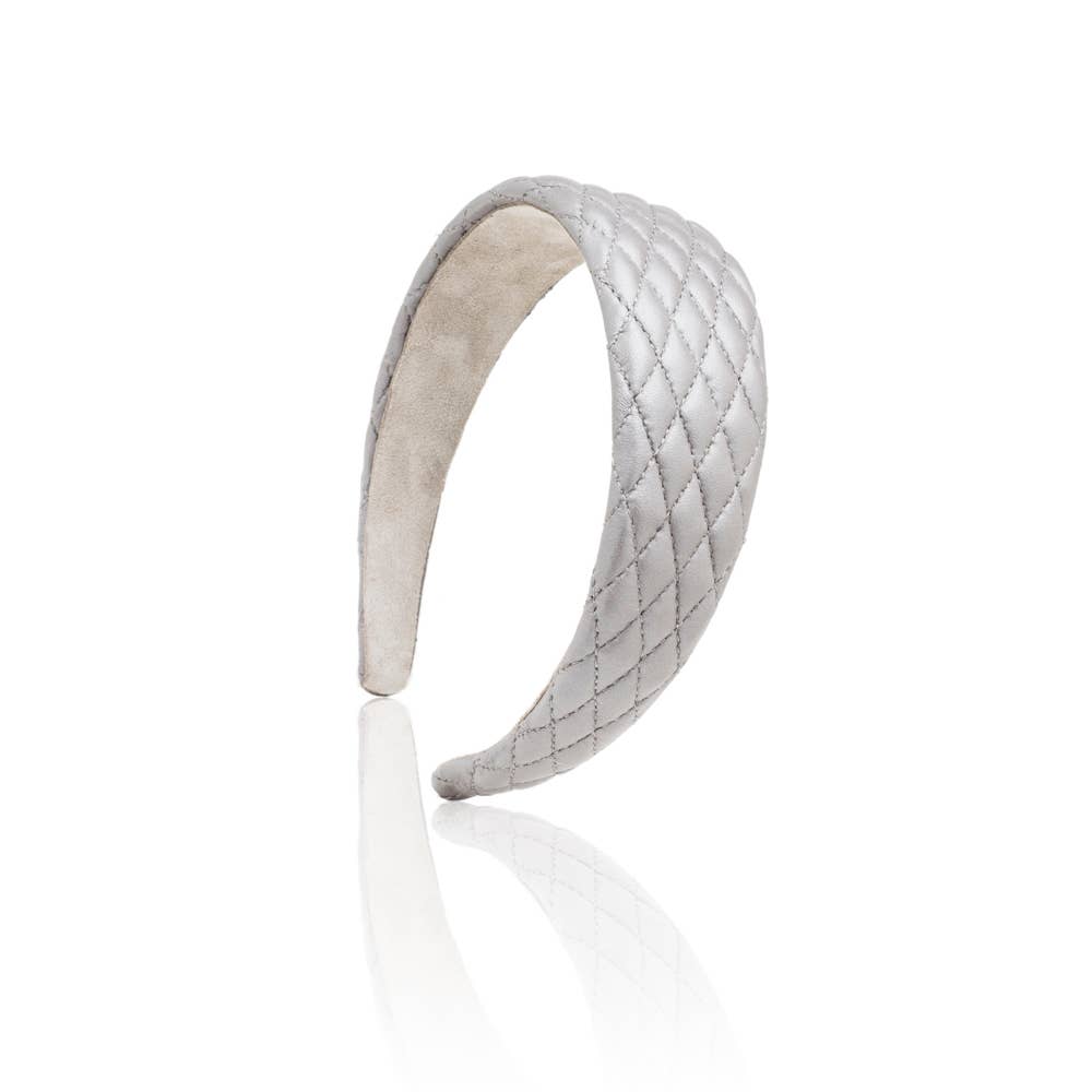 Quilted gray leather headband on a white background