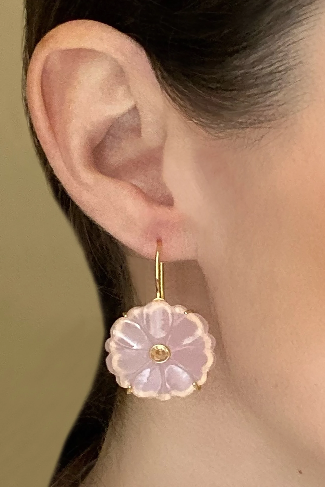 A model is wearing the Magnolia Blush Pink Quartz Earrings and the photo is closely showing her right ear.