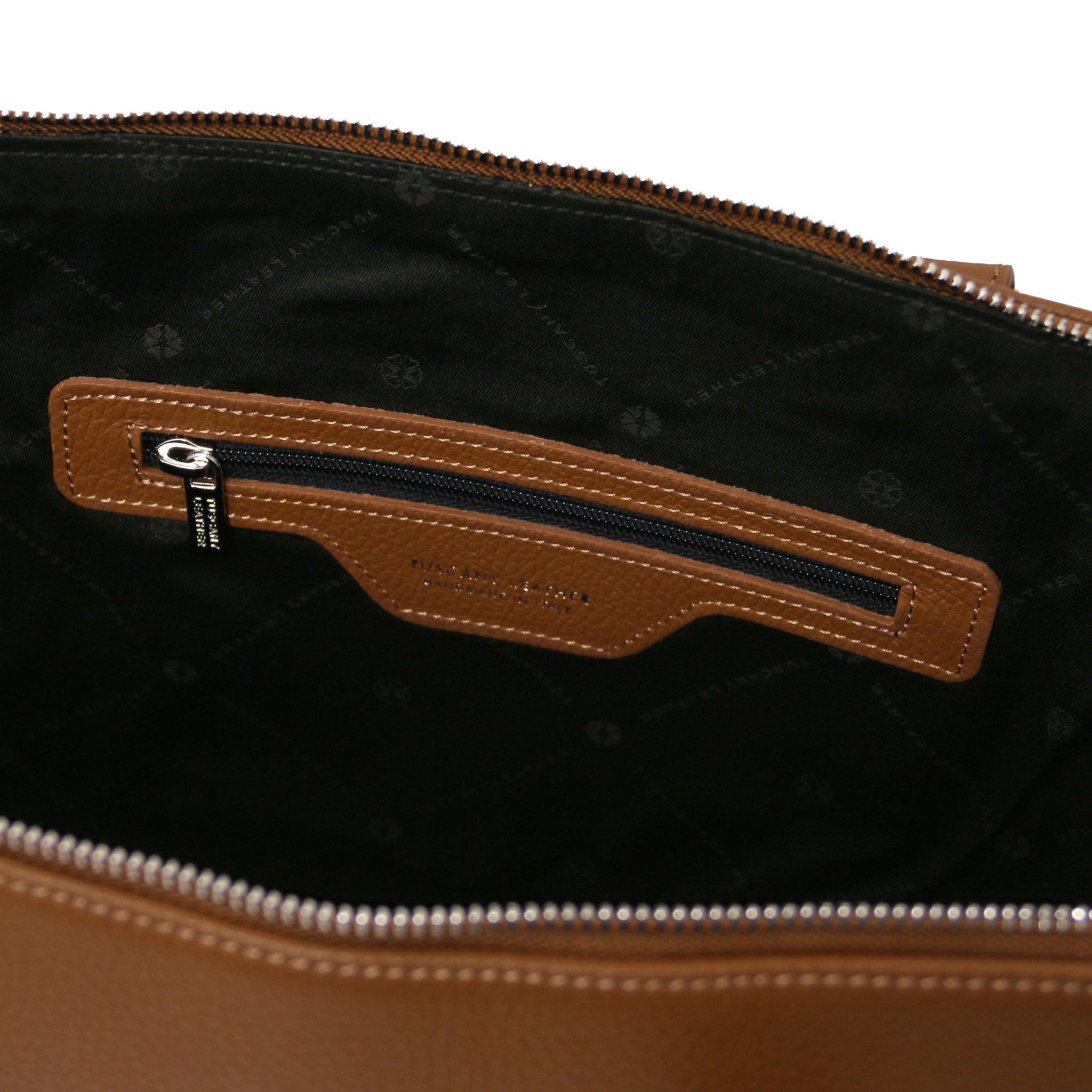 Interior zippered pocket view Magnolia Italian Leather Business Bag in cognac showing black bag lining
