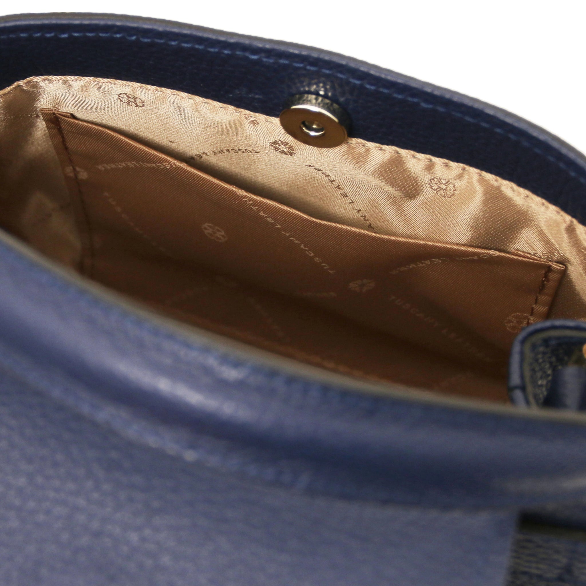 Interior Open Pocket View Maisy Italian Leather Small Tote Bag in dark blue showing beige lining