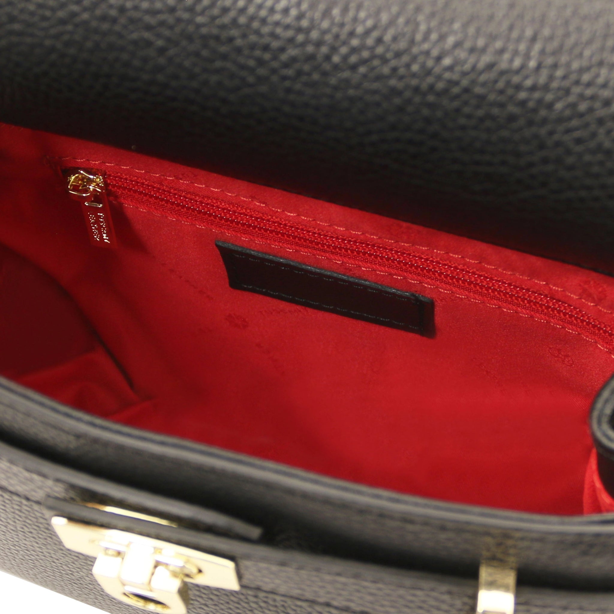 Interior Zip Pocket View Maisy Italian Leather Small Tote Bag in Black showing vibrant red lining