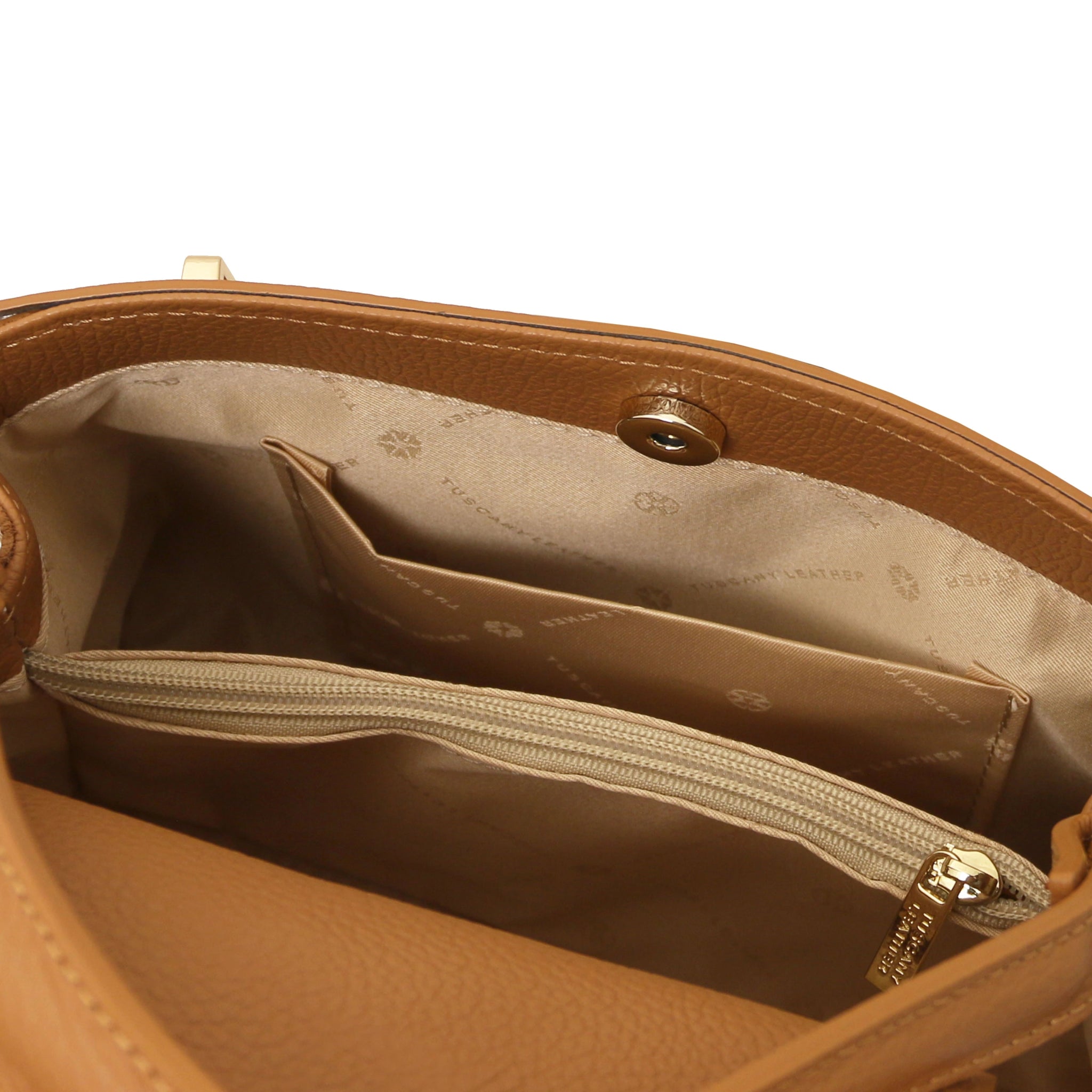 Interior opened pocket view Maisy Italian Leather Tote Bag in Caramel showing the beige bag lining
