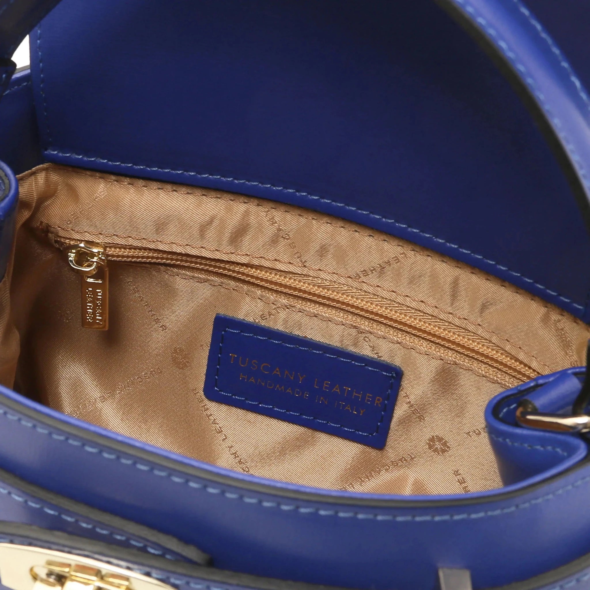 interior zip pocket view Maisy Italian Leather Tote Bag in Blue showing its beige bag lining