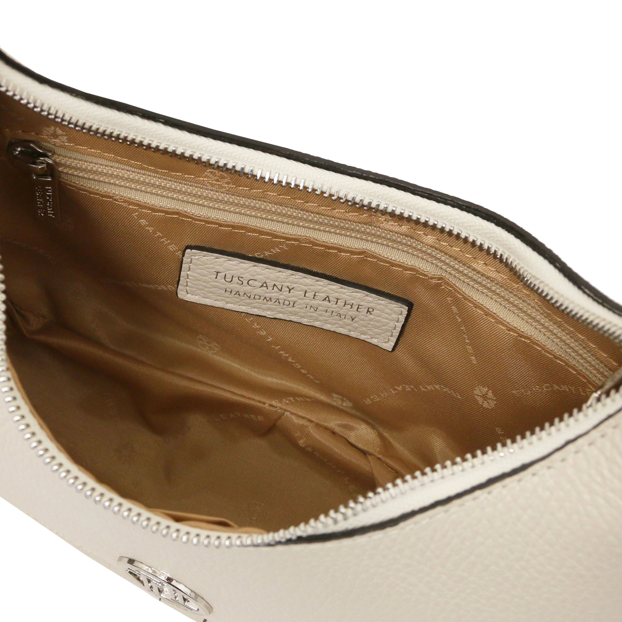 Close-up of a beige leather bag with a ta interior and zip pocket, brand label on a white background