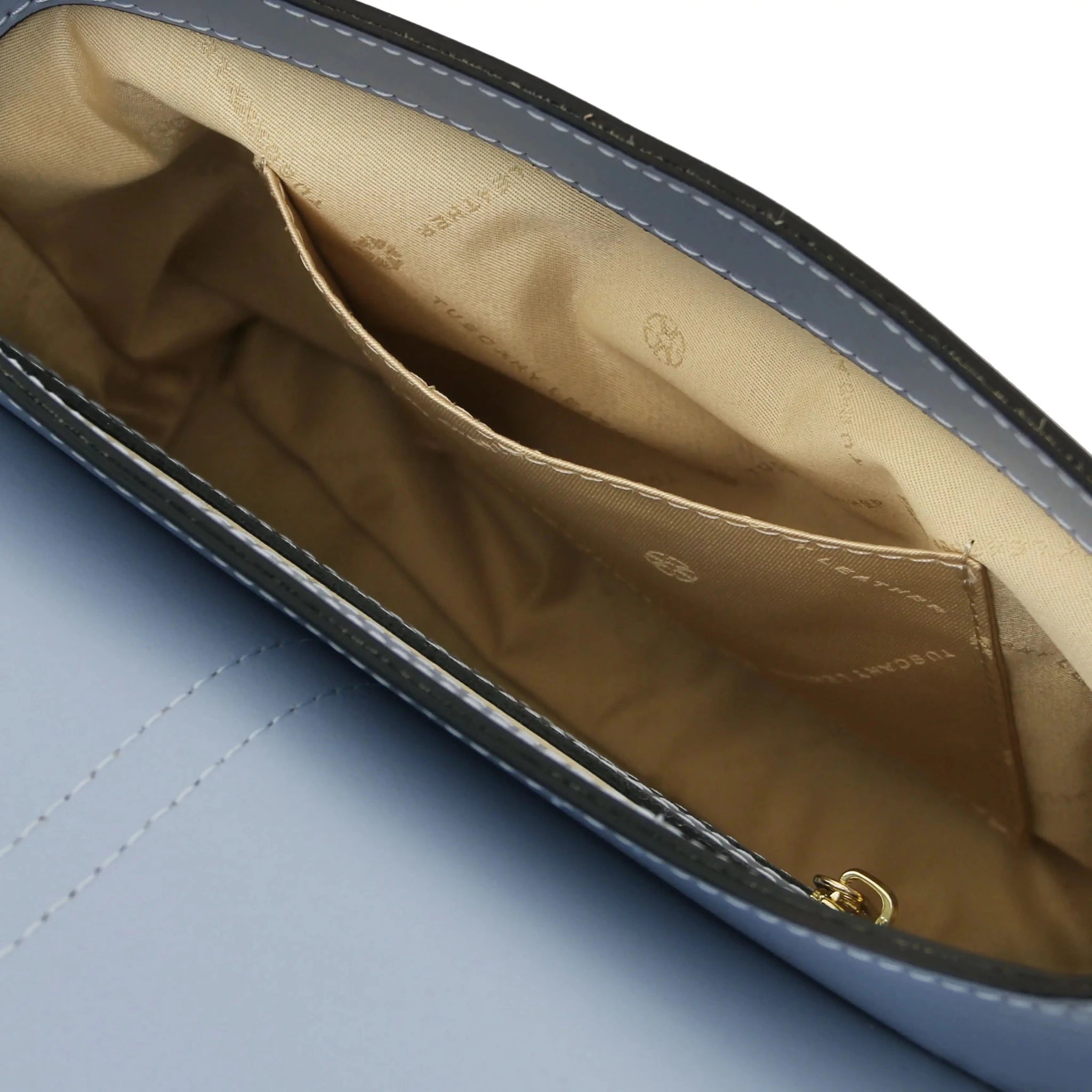 Interior Open Pocket View Nausica Leather Shoulder Bag in Light Blue showing beige lining