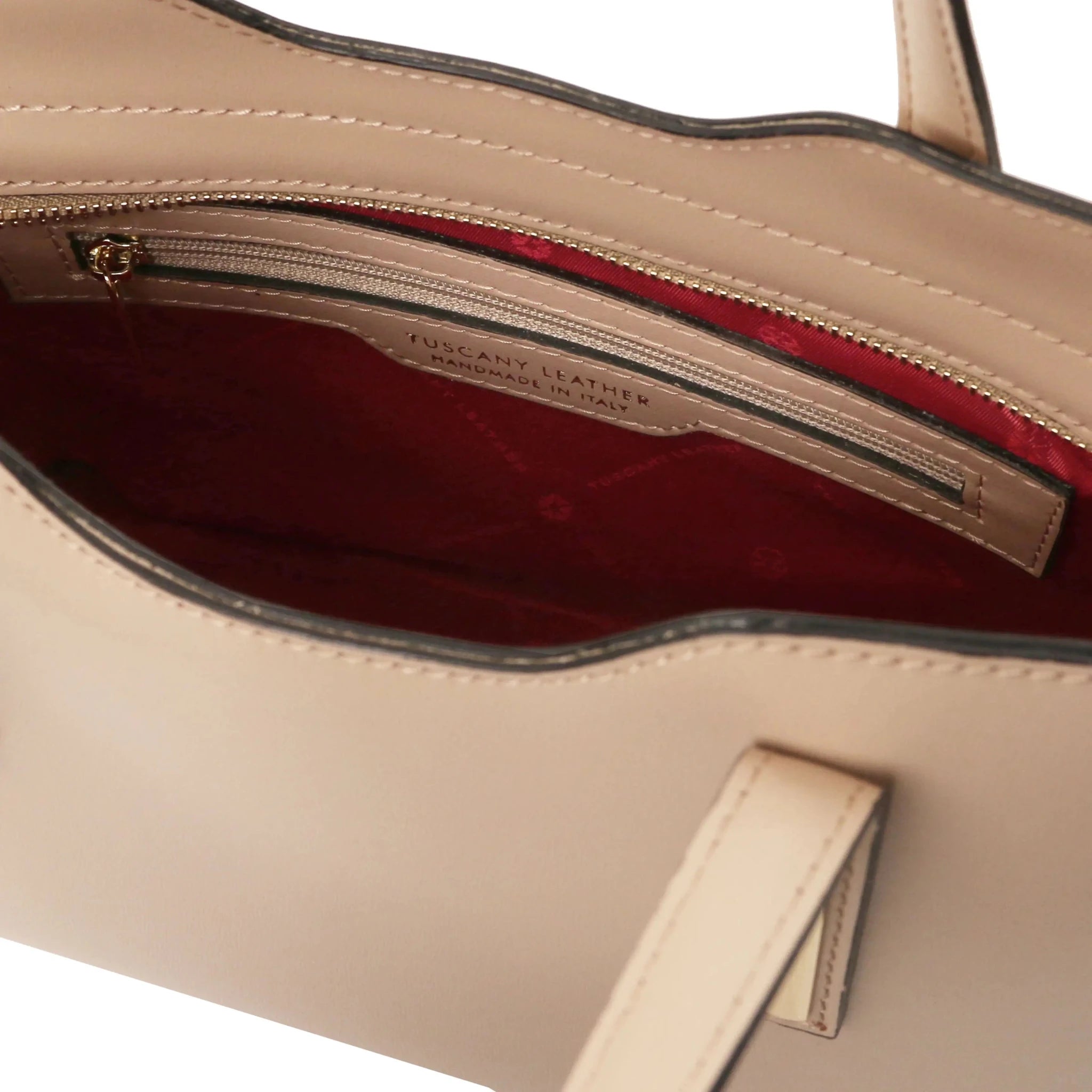 Interior Zip Pockets View Olimpia Leather Tote in Light Taupe showing red lining