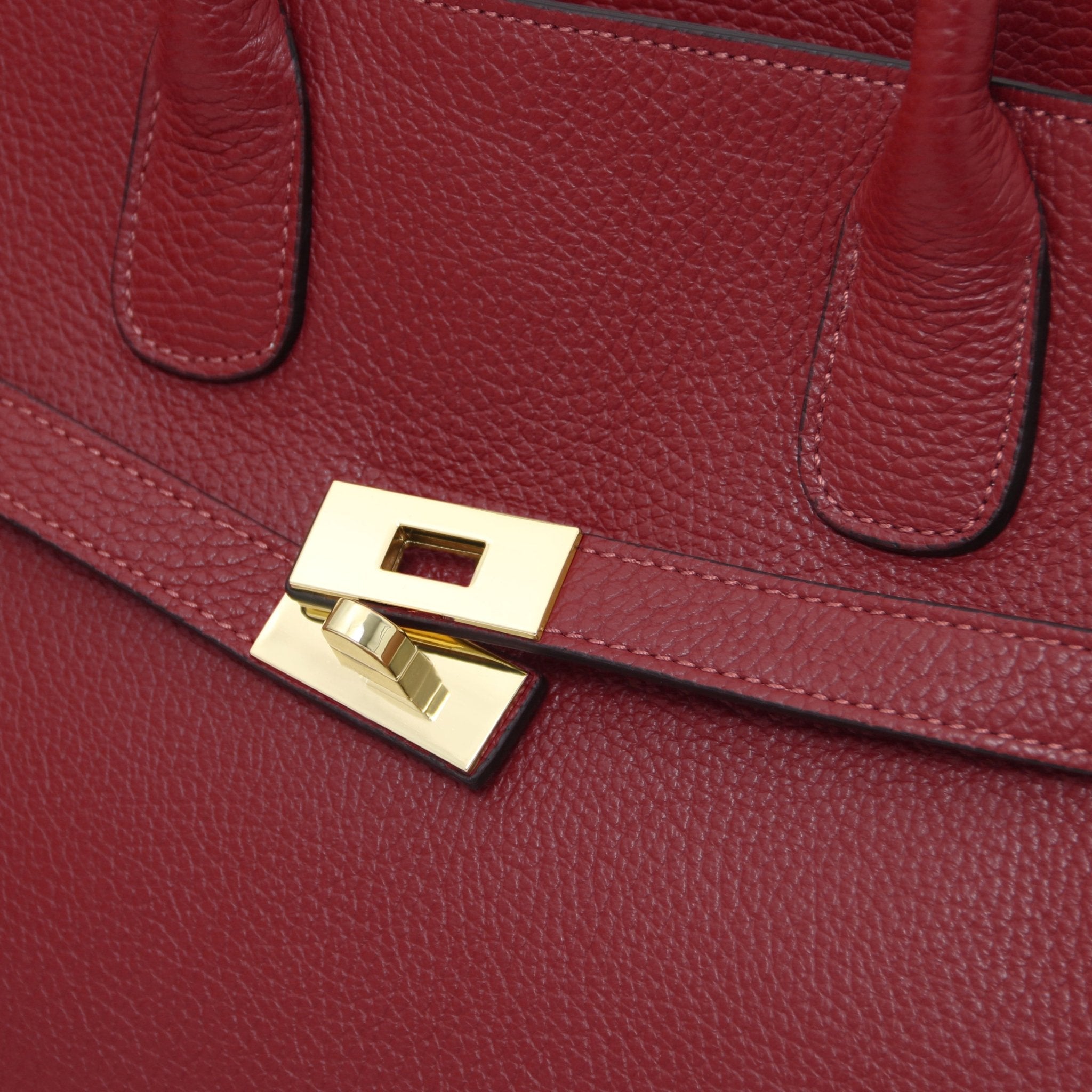 Close up Origami Italian Pebbled Leather Tote in red front gold twist lock
