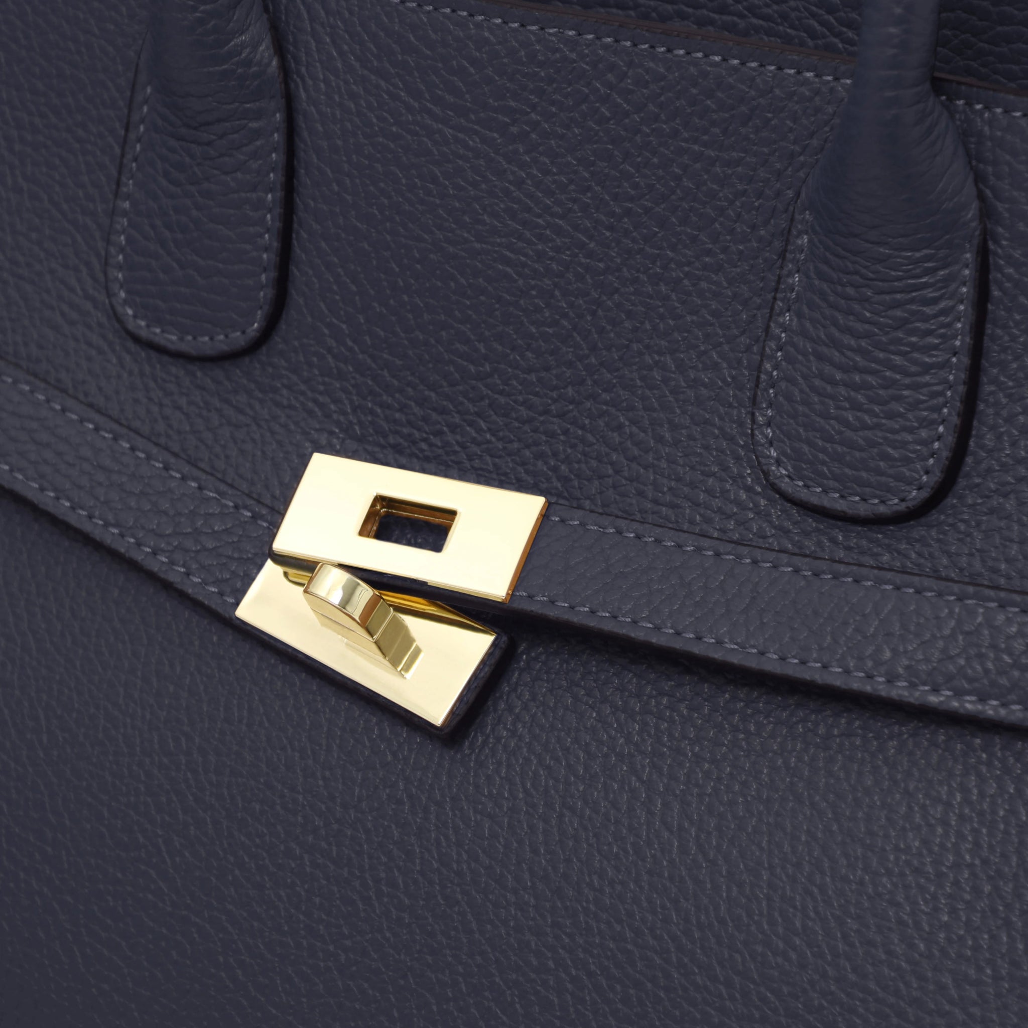Close up Origami Italian Pebbled Leather Tote in dark blue front gold twist lock