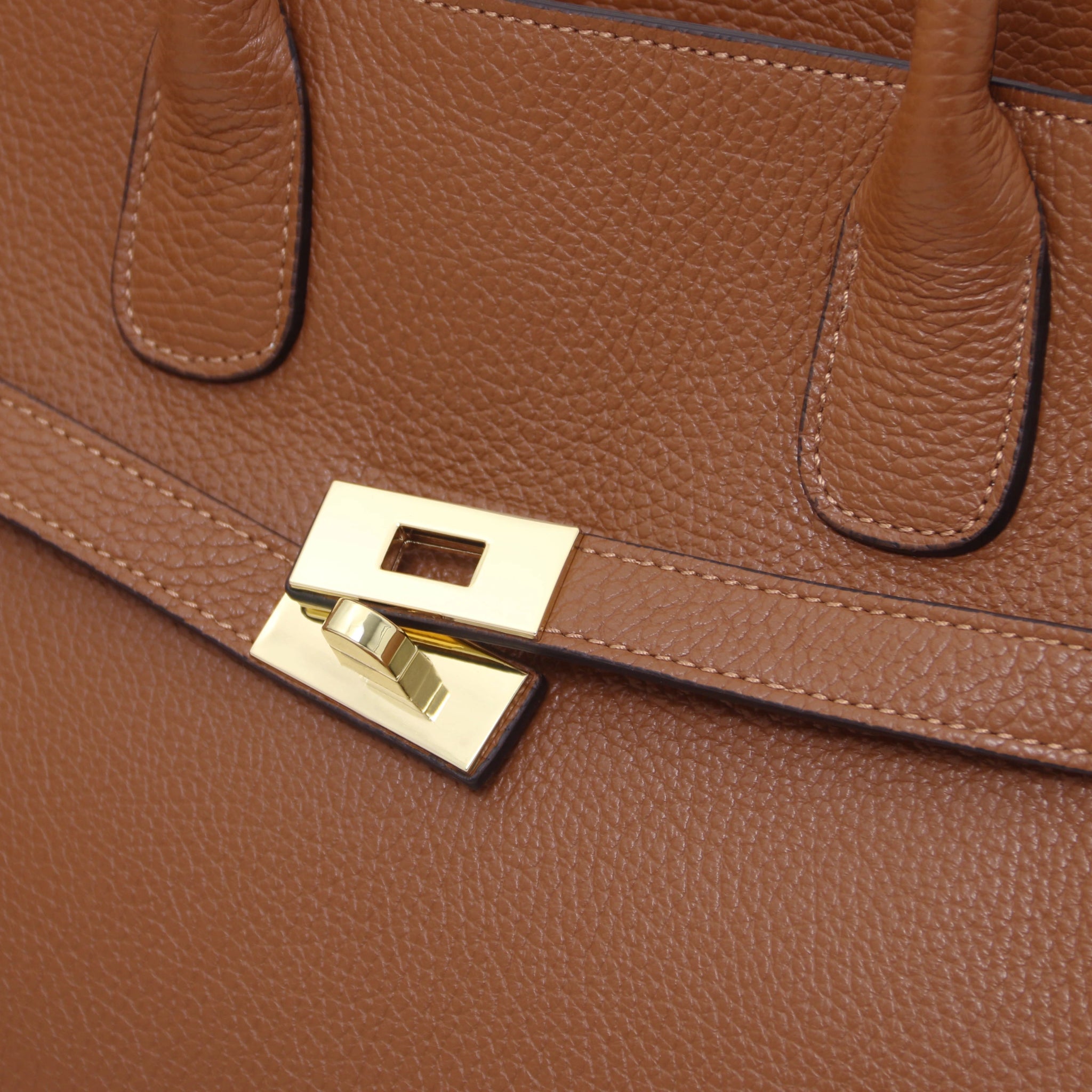 Close up Origami Italian Pebbled cognac front gold twist lock