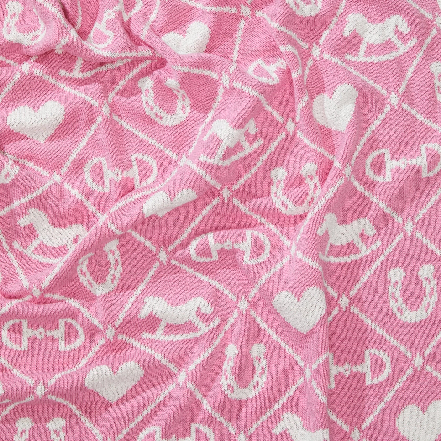 Pony Dreams Reversible Throw in Pink close up view of the pattern.