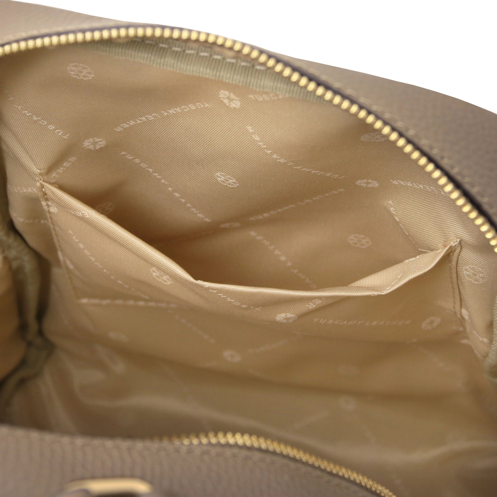 Interior open pocket view Prisma Leather Backpack in dark taupe with beige lining