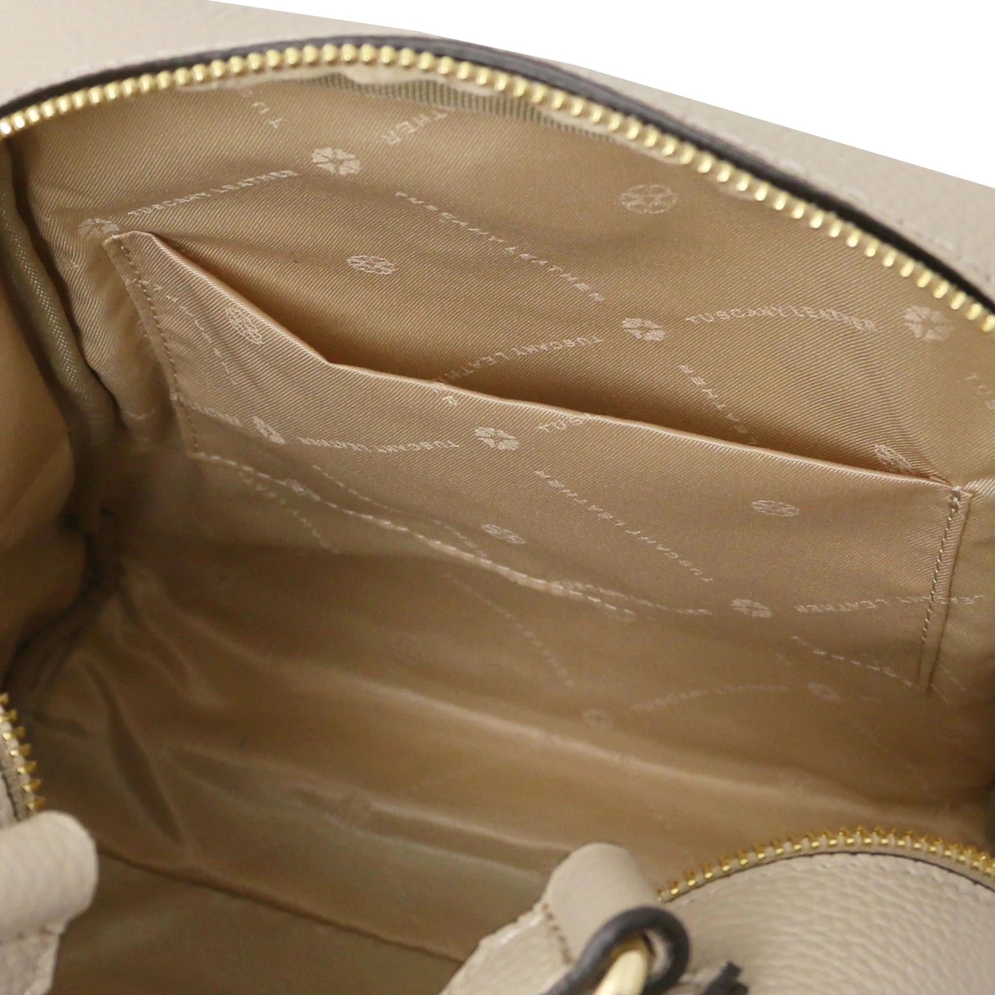 Interior open pocket view Prisma Leather Backpack in light taupe with beige lining