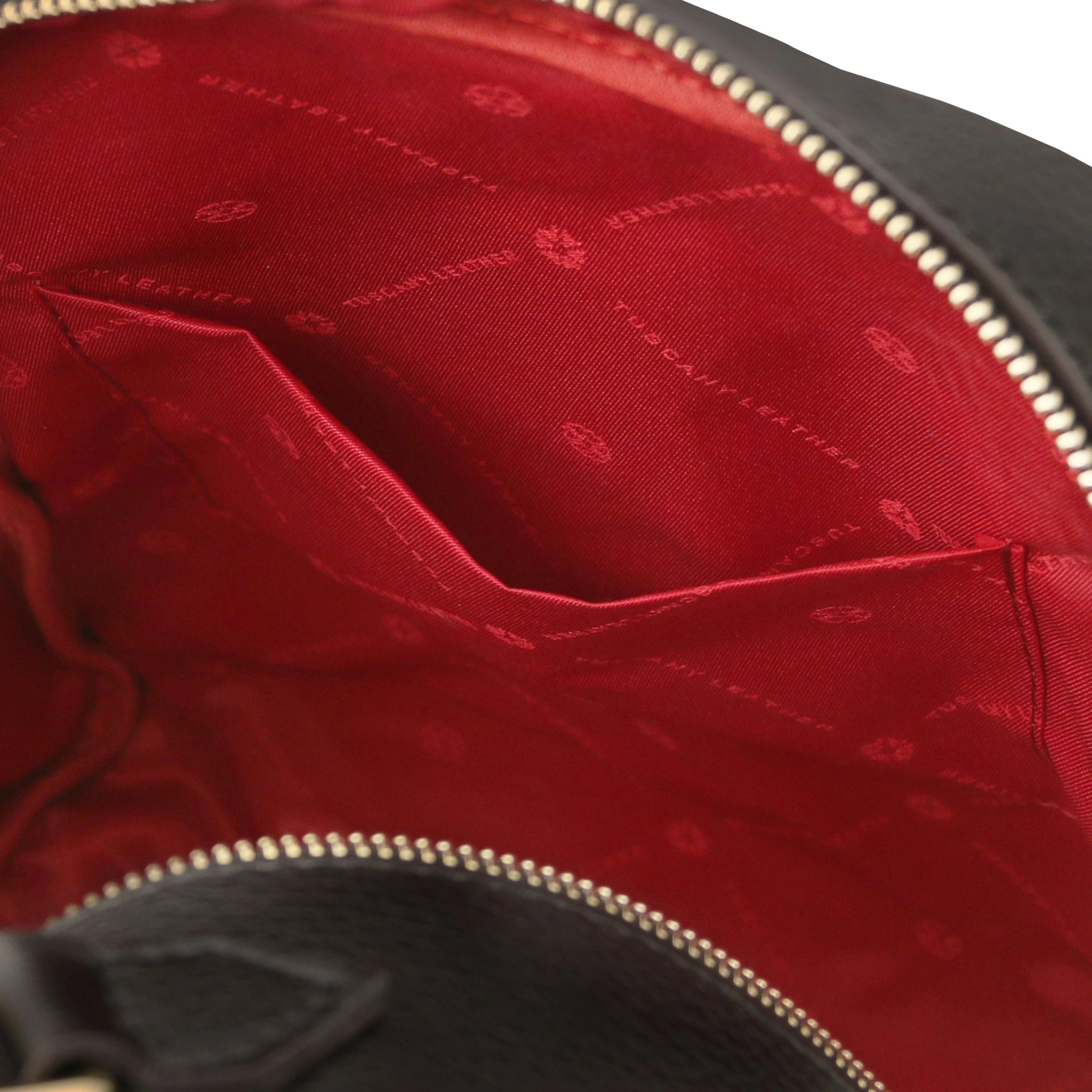 Interior open pocket view Prisma Leather Backpack in black with red lining