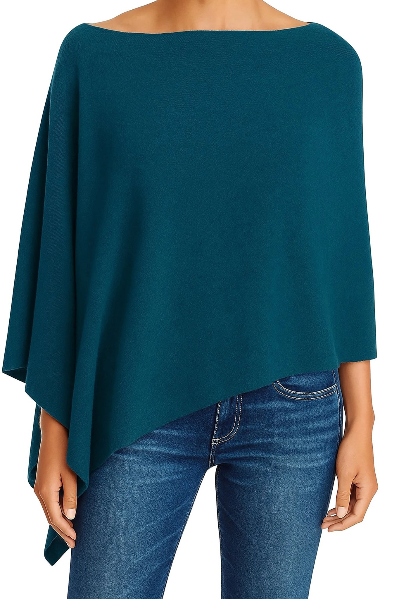 A model wearing the Ravello Cashmere Poncho in teal on blue jeans