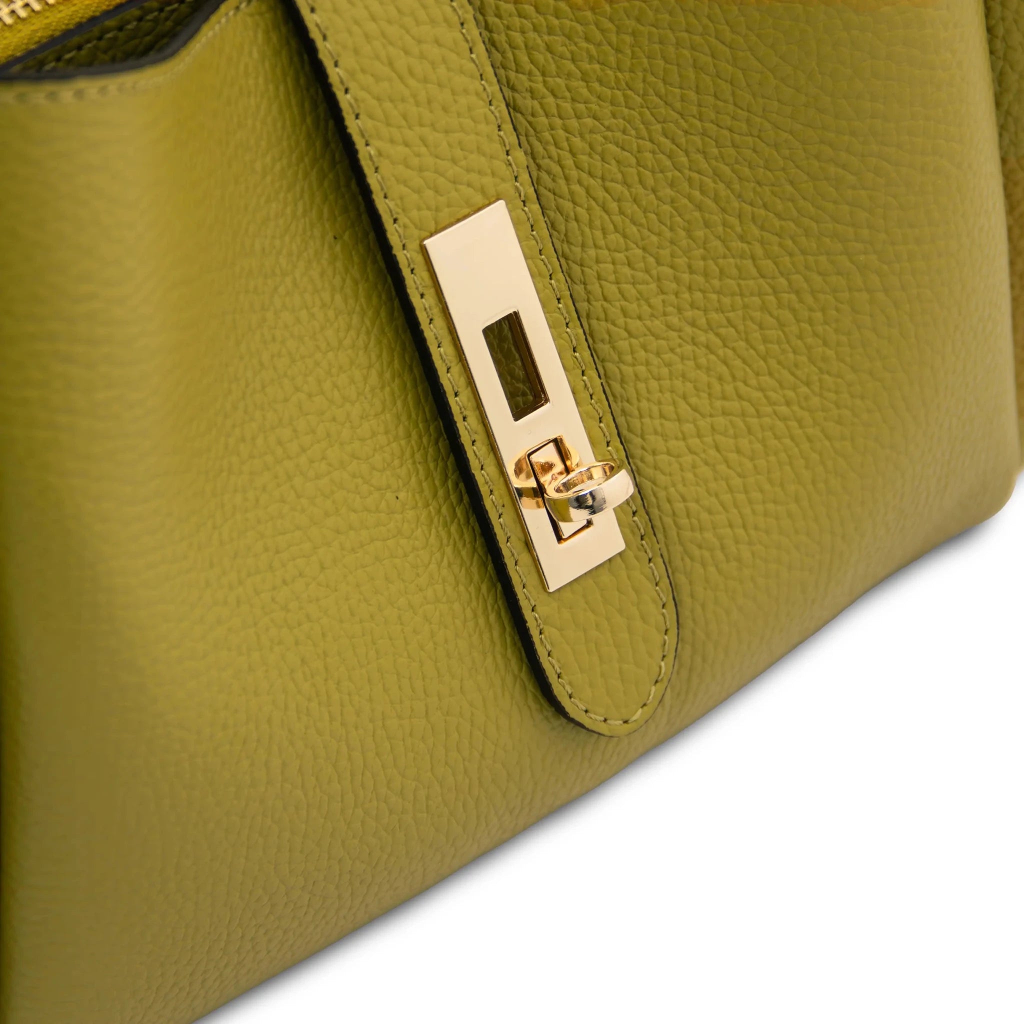 Close up twist lock view Soave Soft Leather Handbag in green on a white background