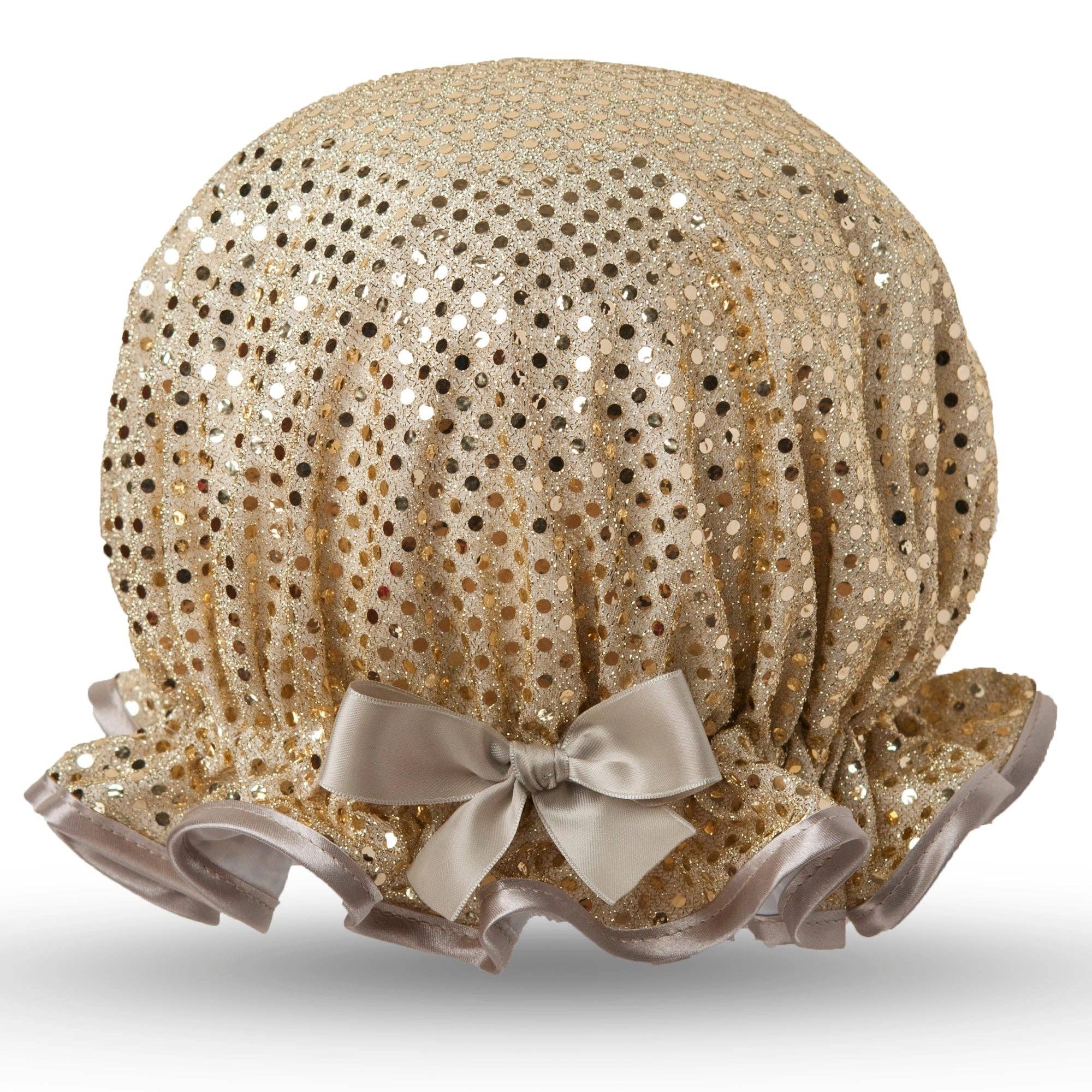Gold sequin bonnet with a bow on a white background