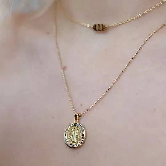 St.Benedict Coin Pendant Ball Chain close up of strand on a woman's chest