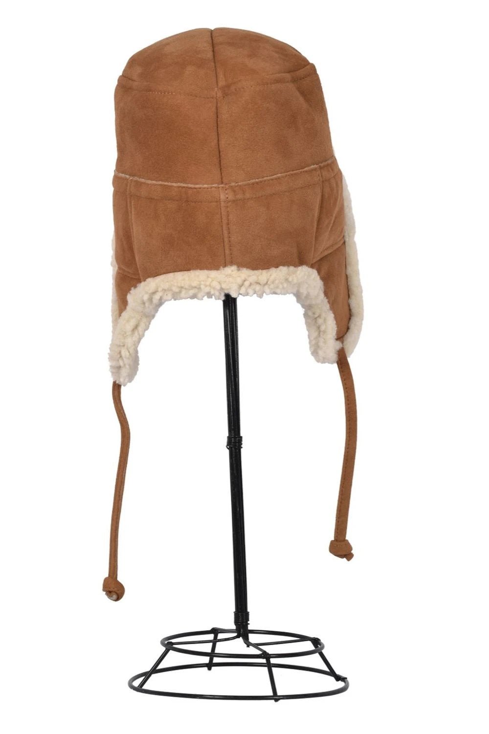 Back view Tie Trapper Sheepskin Ear Flap Hat in Brand Cream on a black hat stand, ear flaps down
