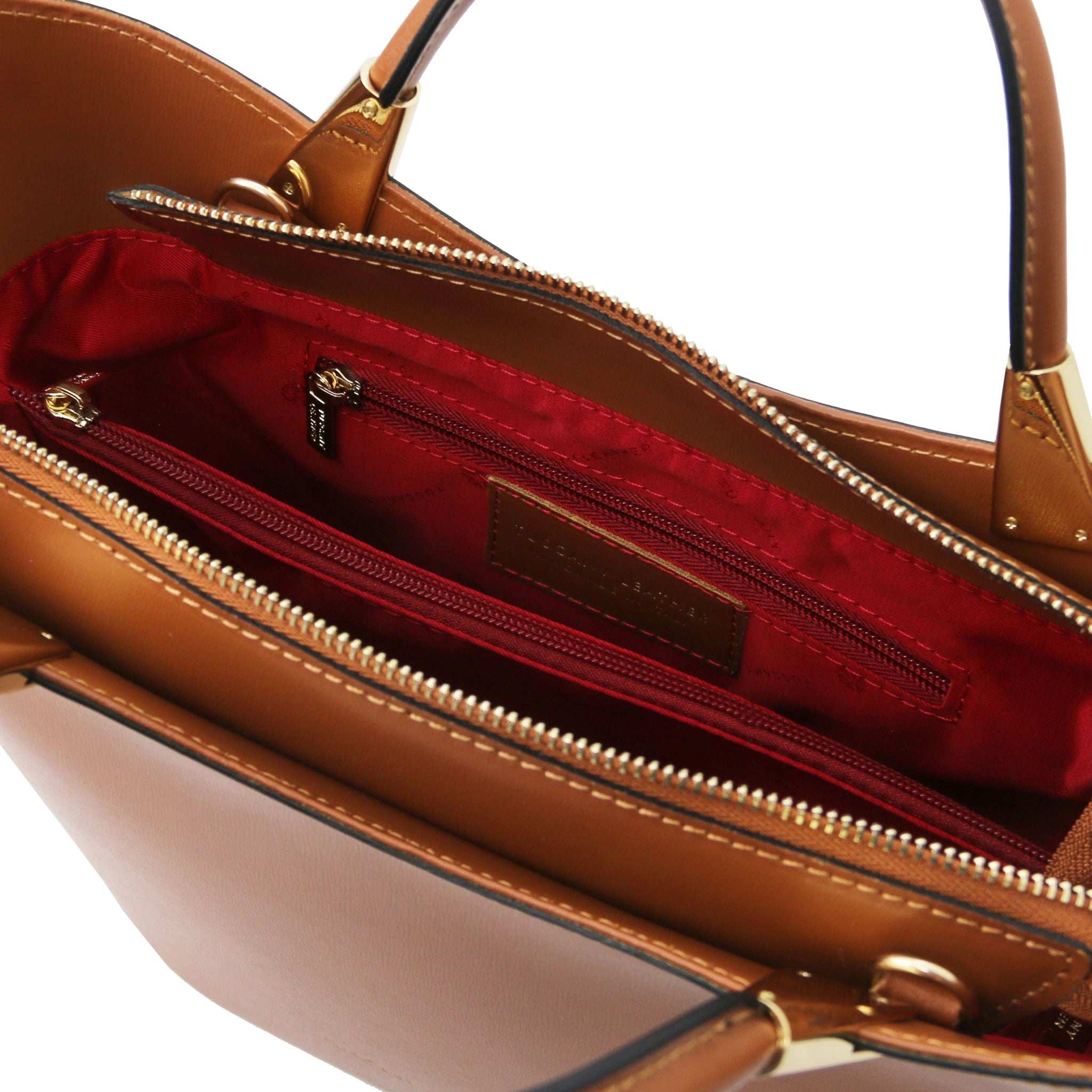 TL Bag Italian Leather Handbag in Cognac interior view showing centered zippered compartment, red lining and zippered pocket