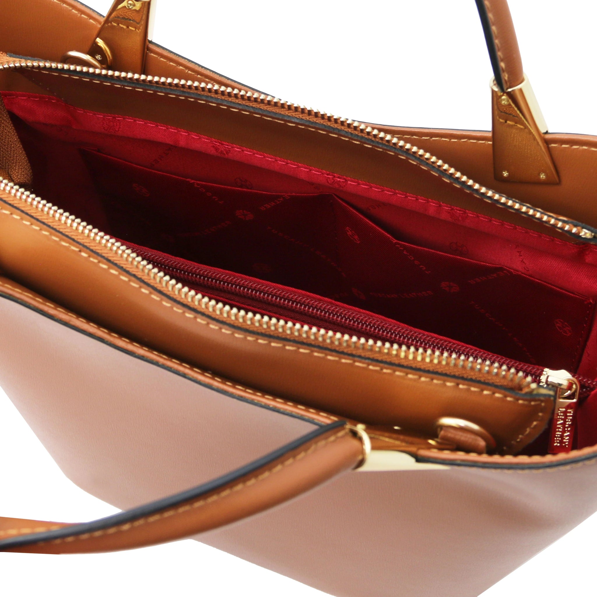 TL Bag in Cognac interior view showing centered zippered, red lining, compartment and open pockets
