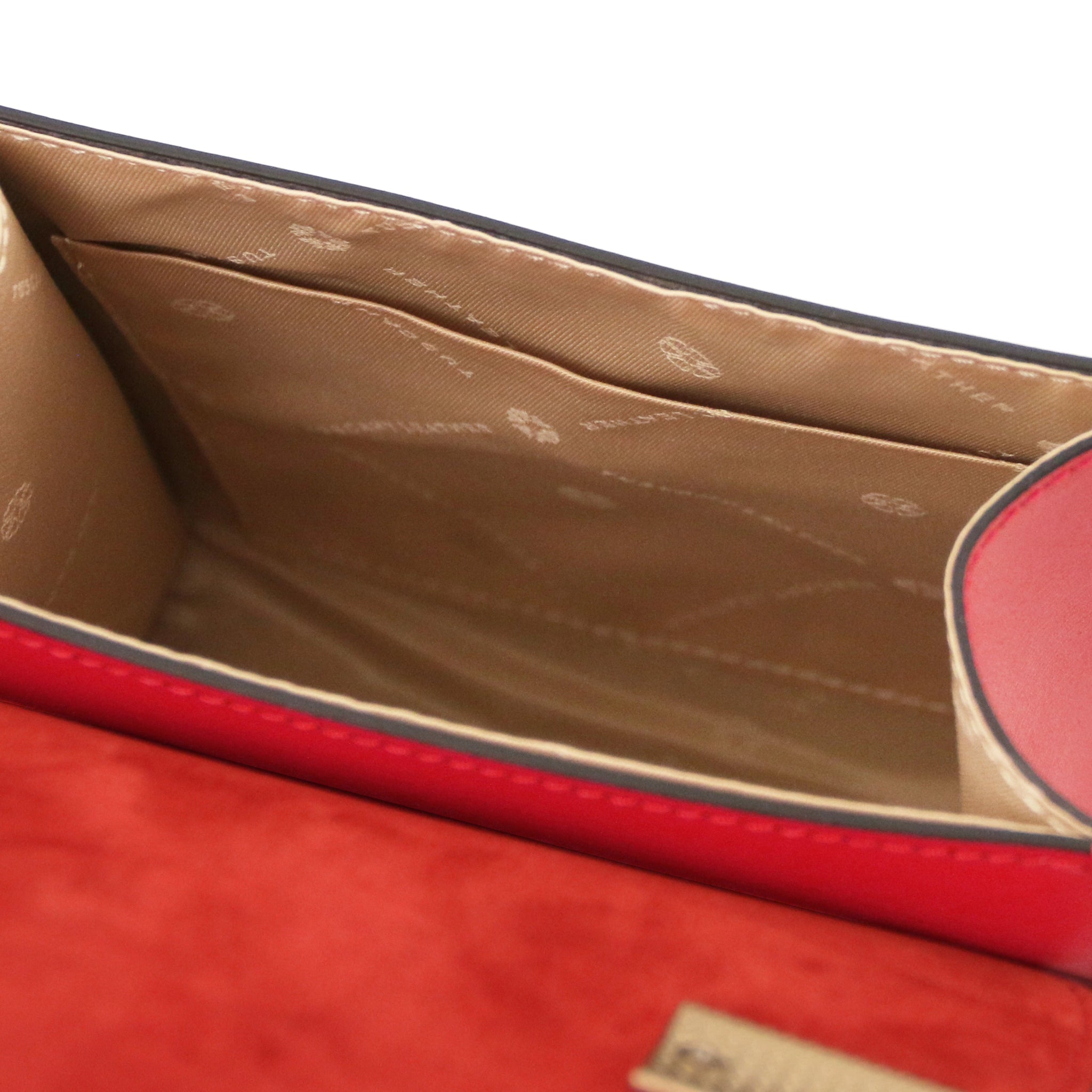 Interior view TL Bag Italian Leather Mini Bag in red showing interior open pocket and beige lining
