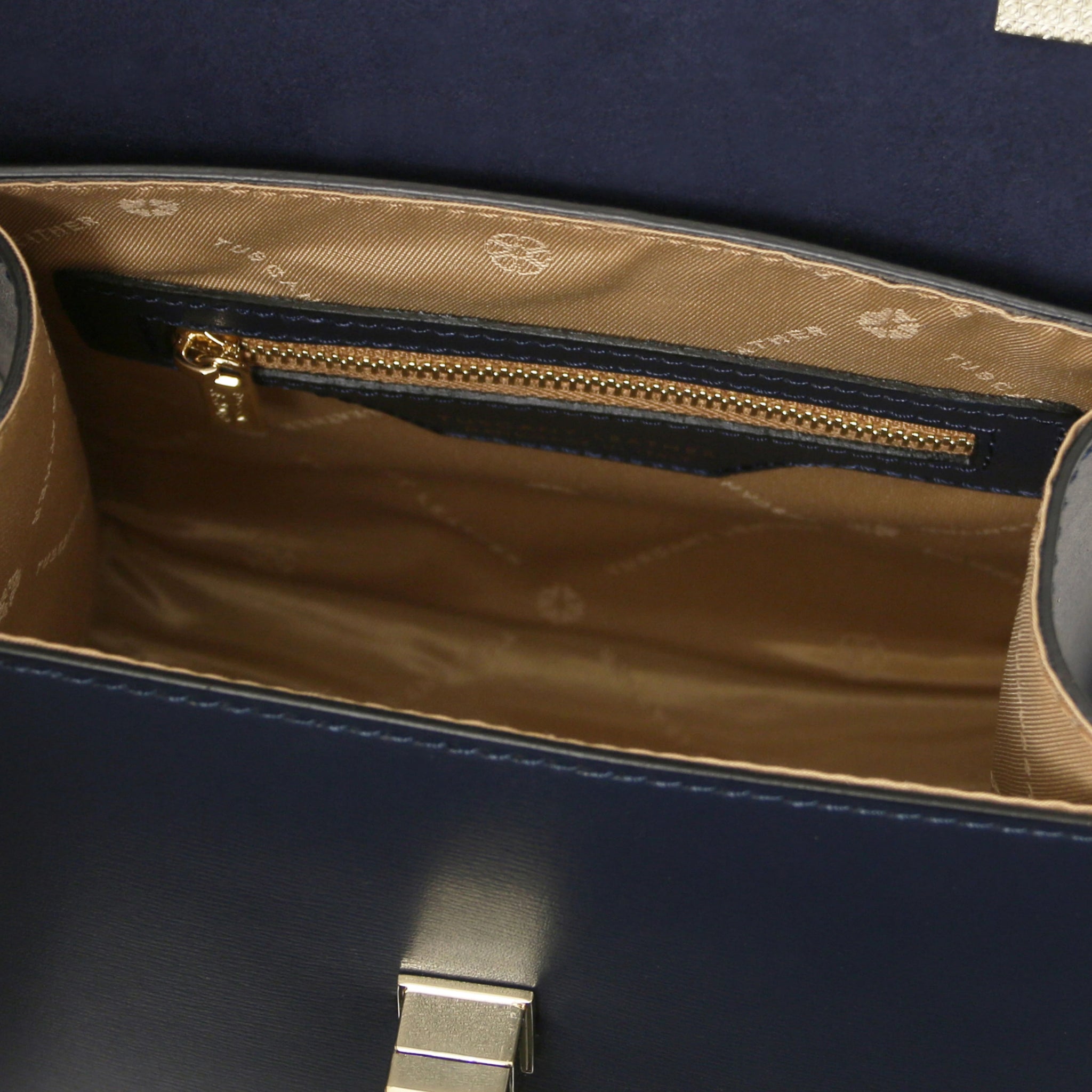 Interior zip pocket view TL Bag Italian Leather Mini Bag in dark blue with beige lining