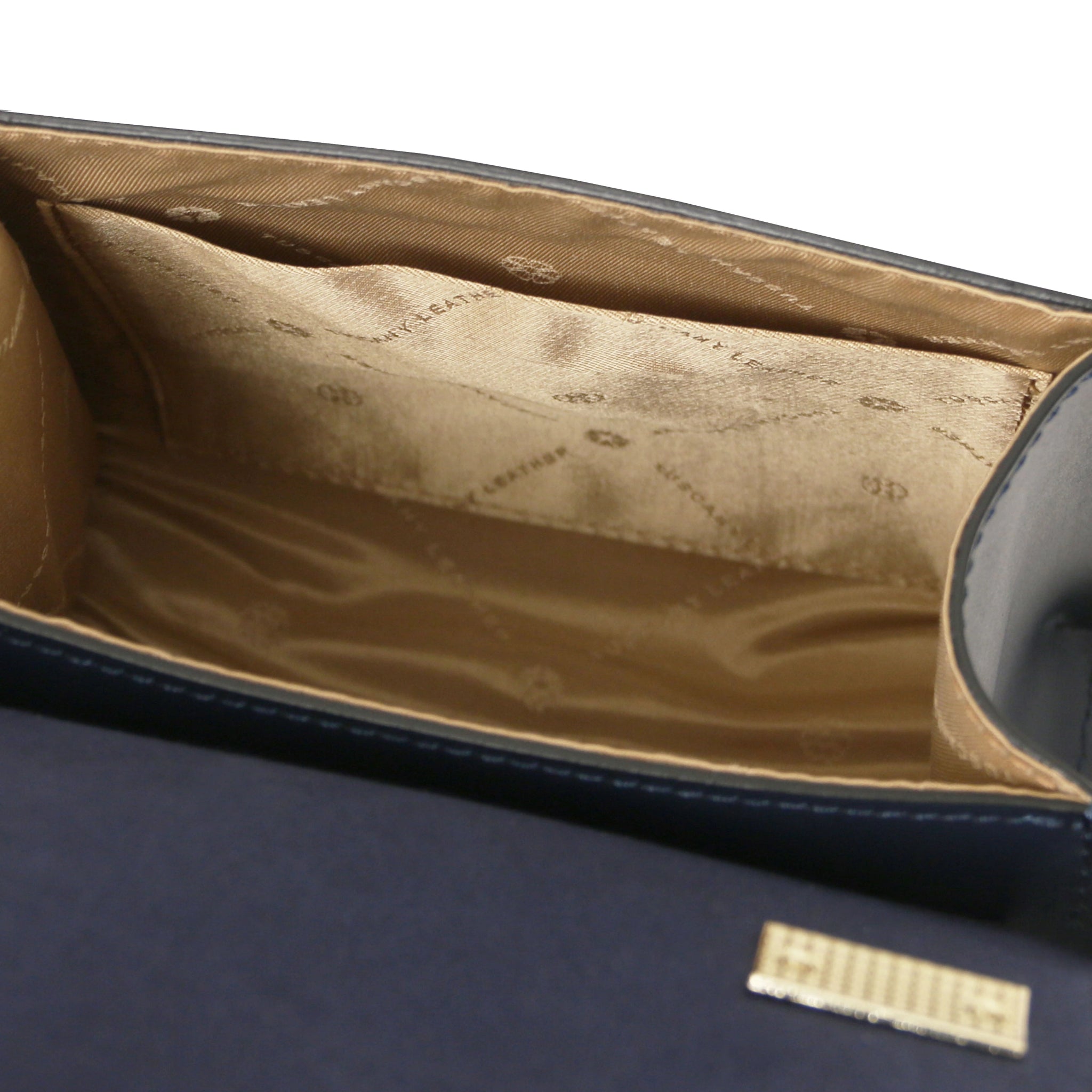 Interior open pocket view TL Bag Italian Leather Mini Bag in dark blue with beige lining.