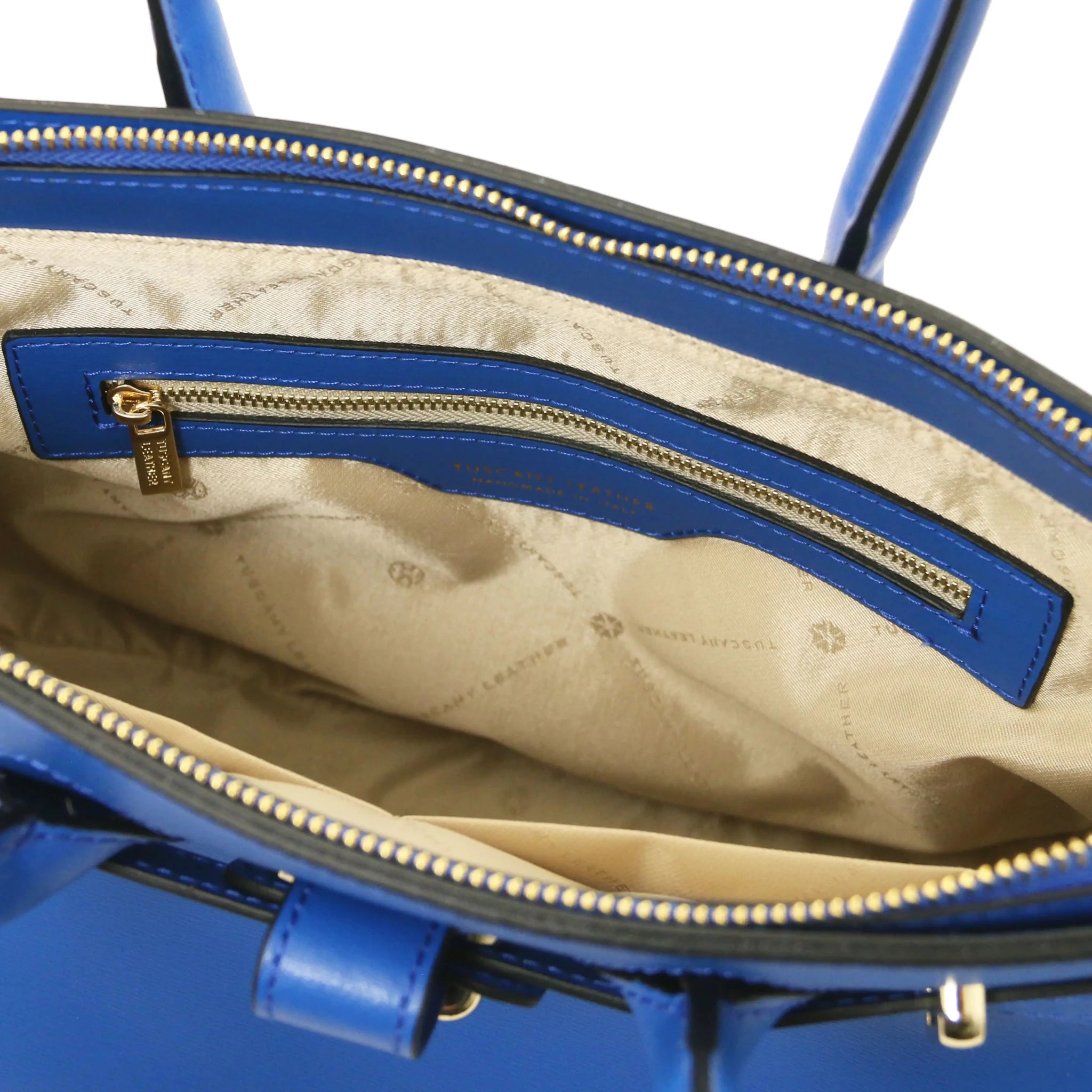 Interior zip pocket view TL Bag in blue with light beige lining