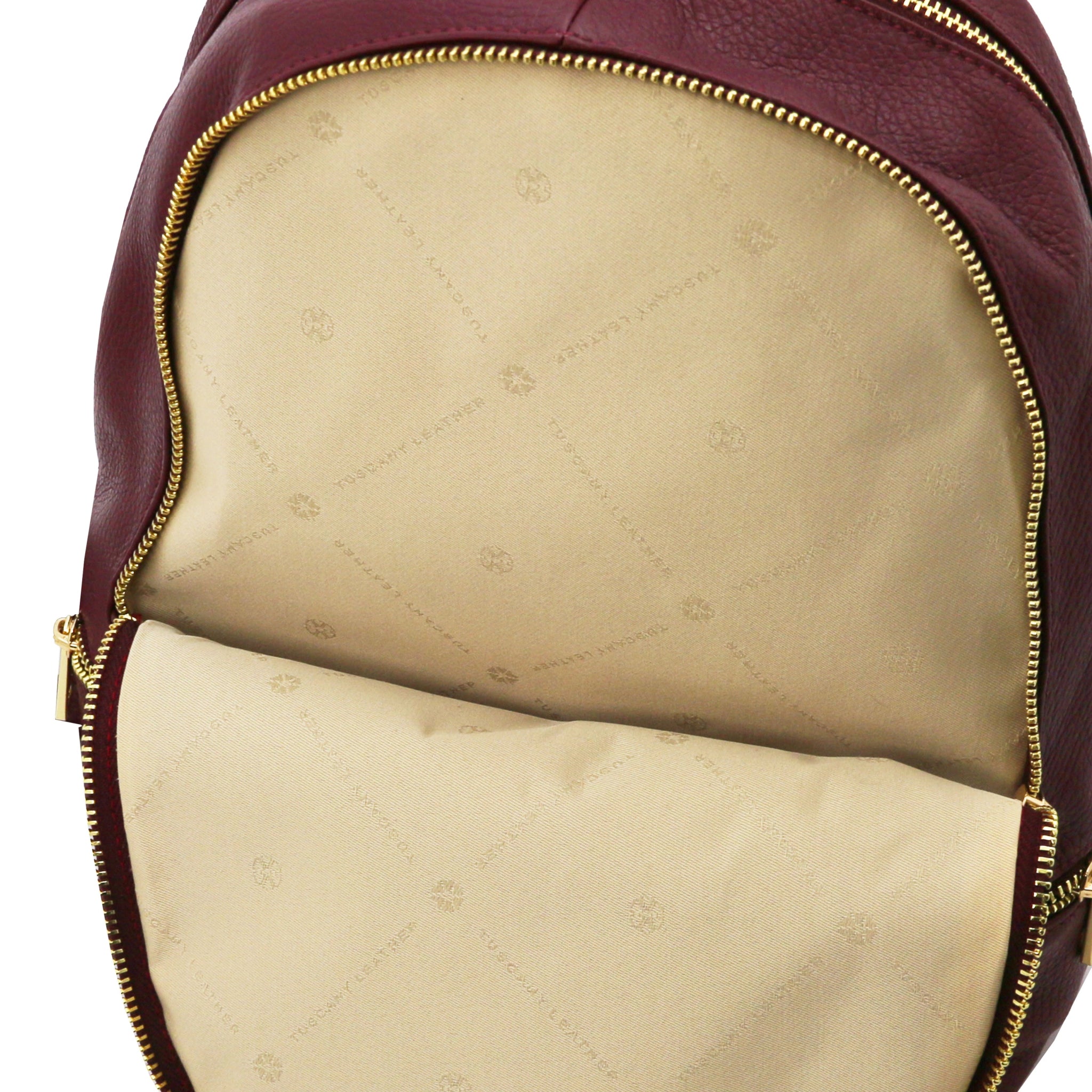 Front beige interior full zip pocket of Bordeaux backpack with gold zipper