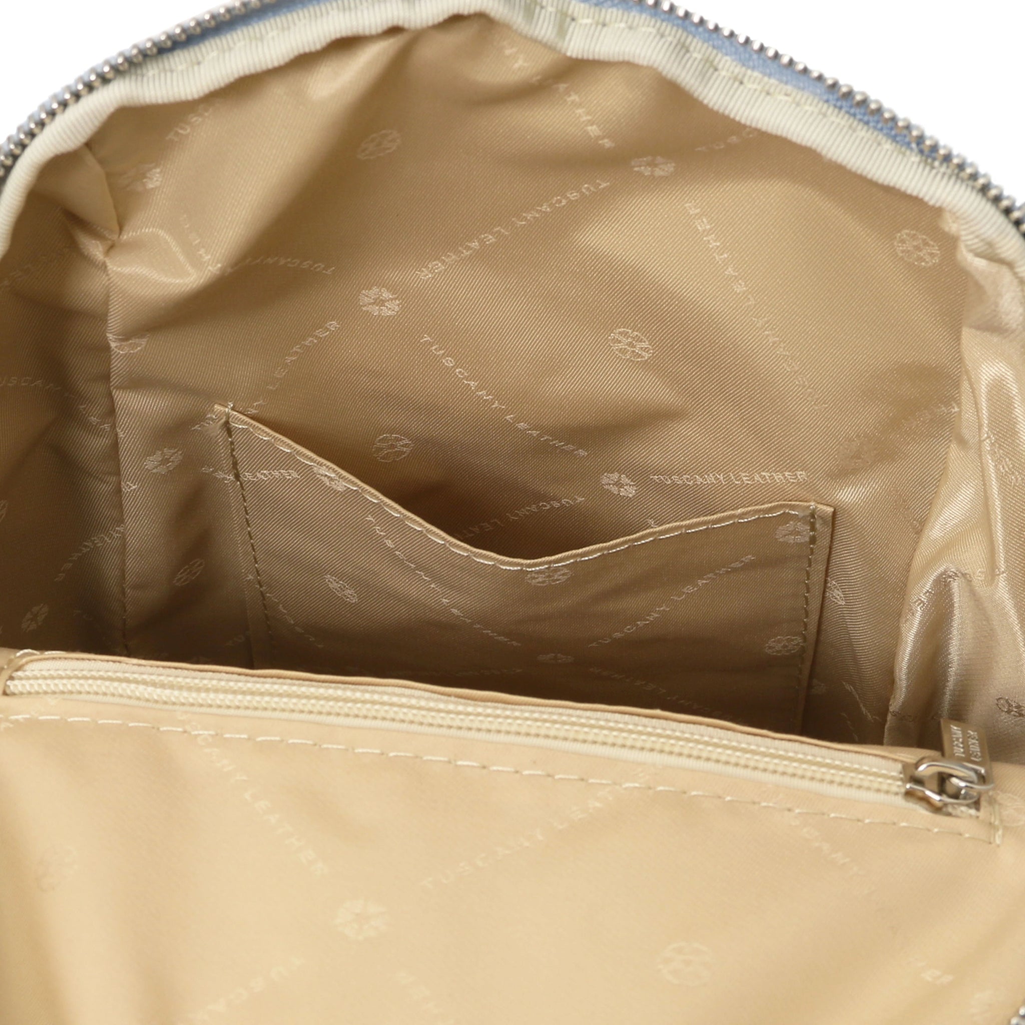 Leather Backpack in Light Blue interior open pocket view showing beige lining